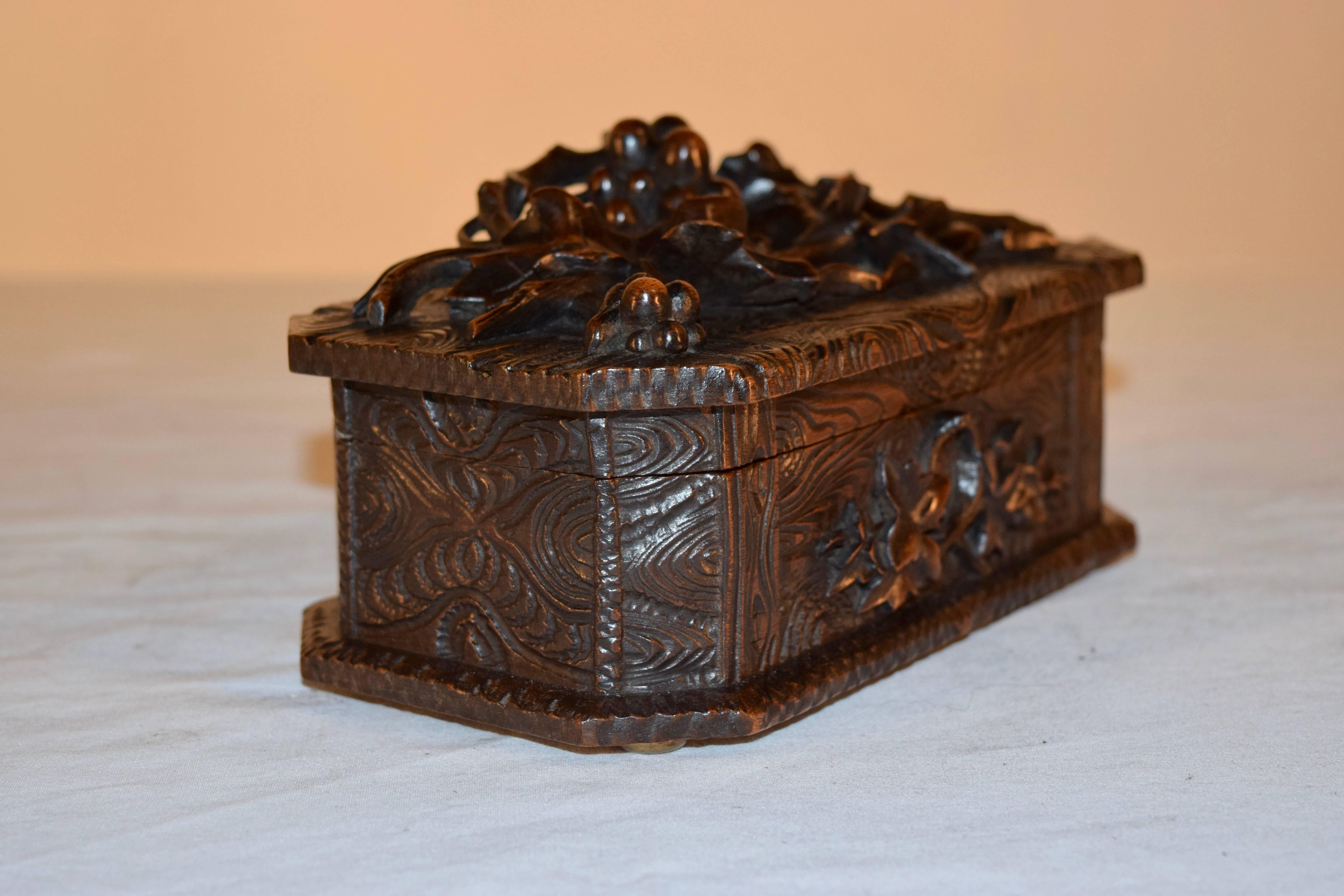 19th century hand-carved jewelry box with branches and leaves with grapes on the top, and hand-carved 