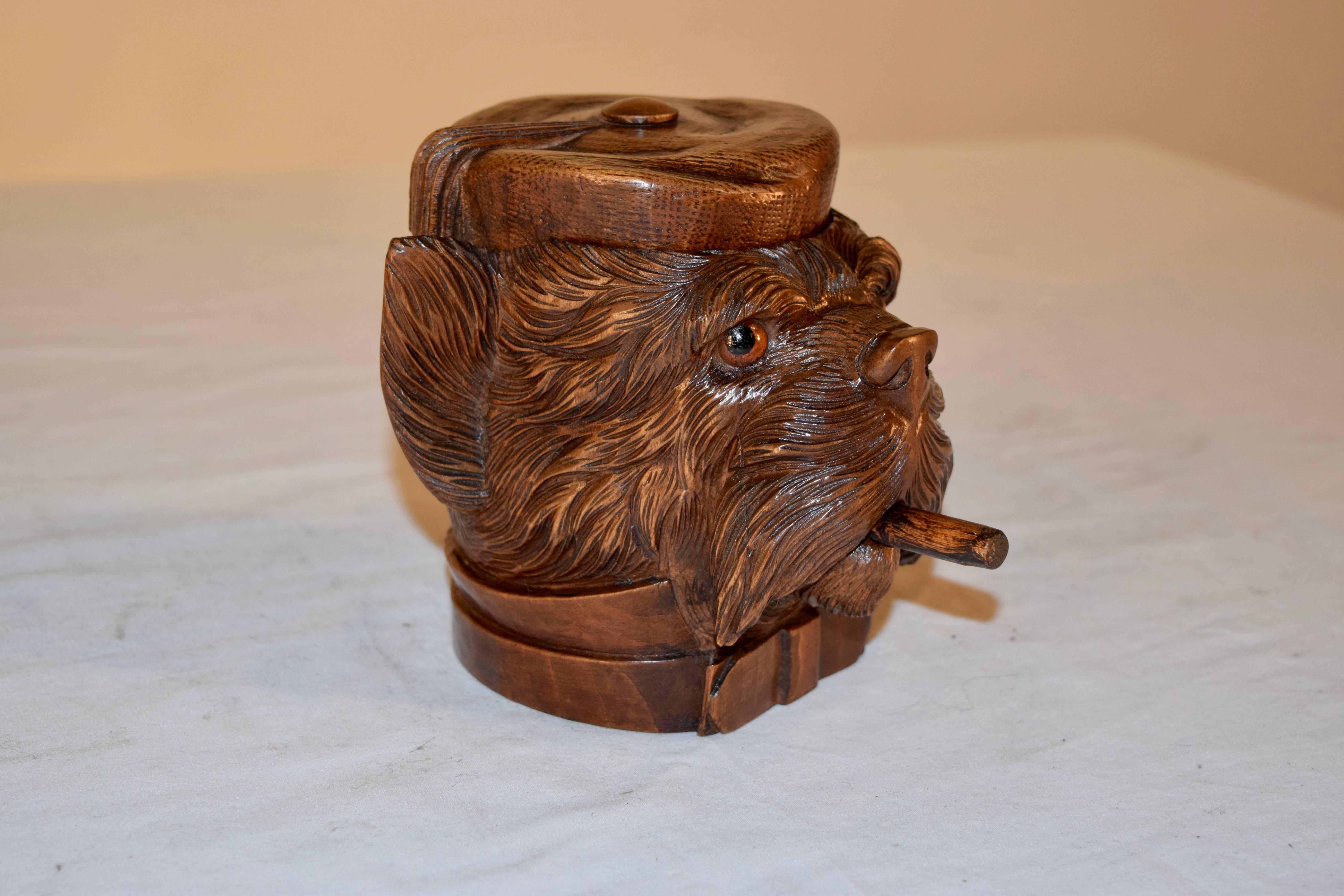 19th century Black Forest hand-carved humidor in the form of a terrier. His hat lifts to reveal an open compartment for storage.