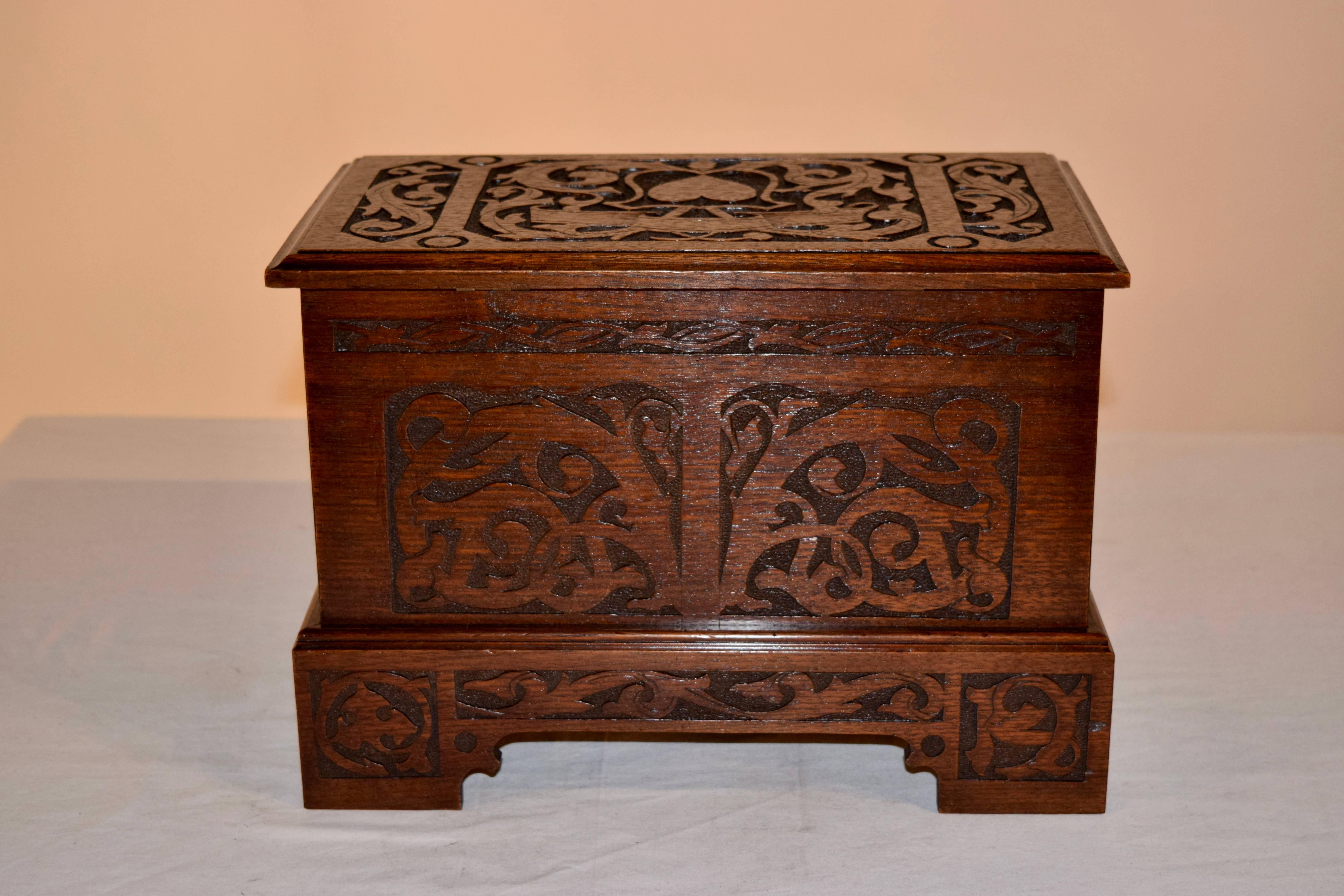 Late 19th century miniature blanket chest with lovely hand-carved decoration on three sides and the top has a carved heart. Great size.
