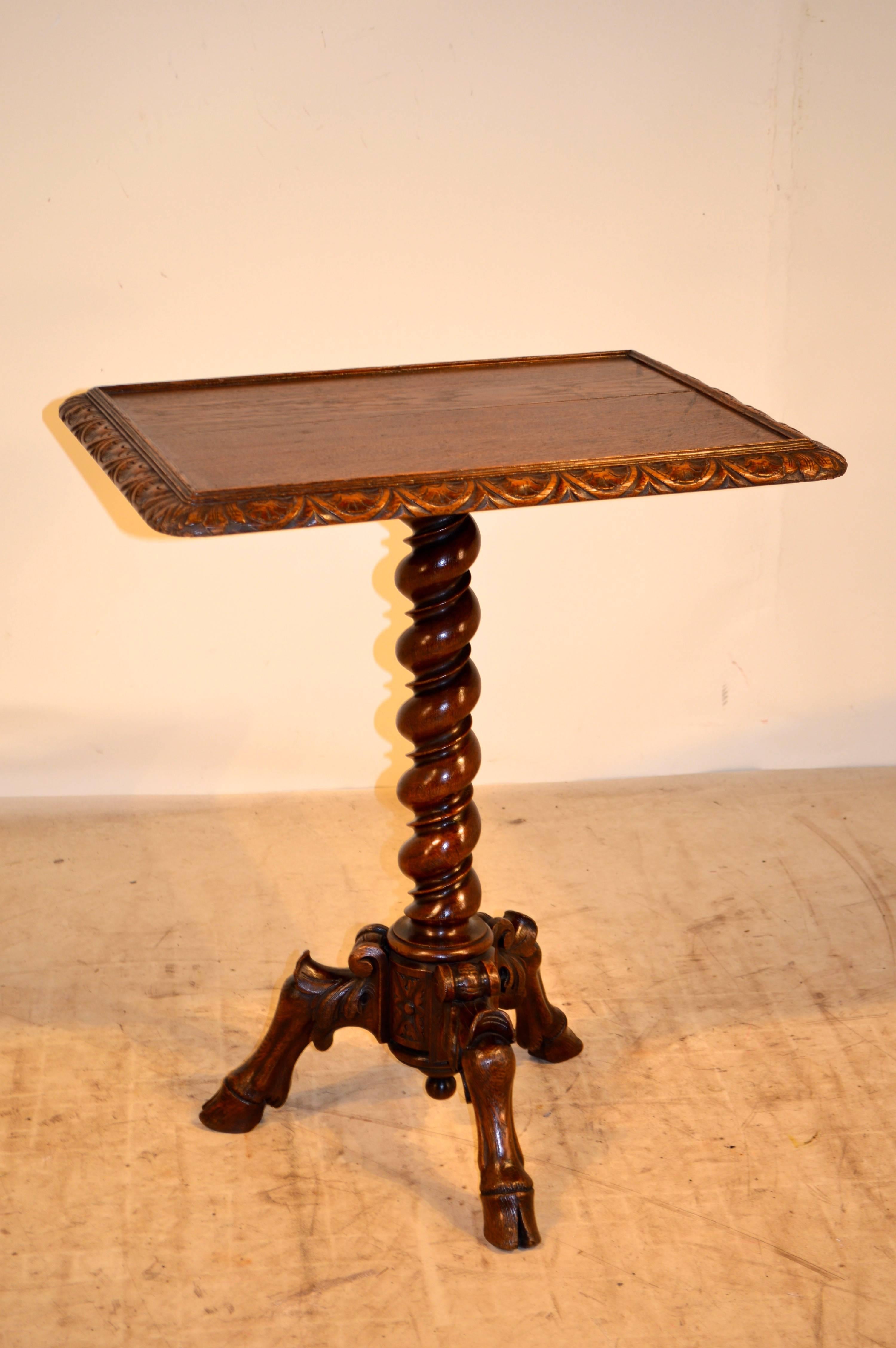 19th century, French side table with a wonderfully carved edge around the multi-layer bevelled top. The pedestal is a hand-turned barley-twist column which is resting on a wonderfully shaped and carved tripod base with hoof feet.