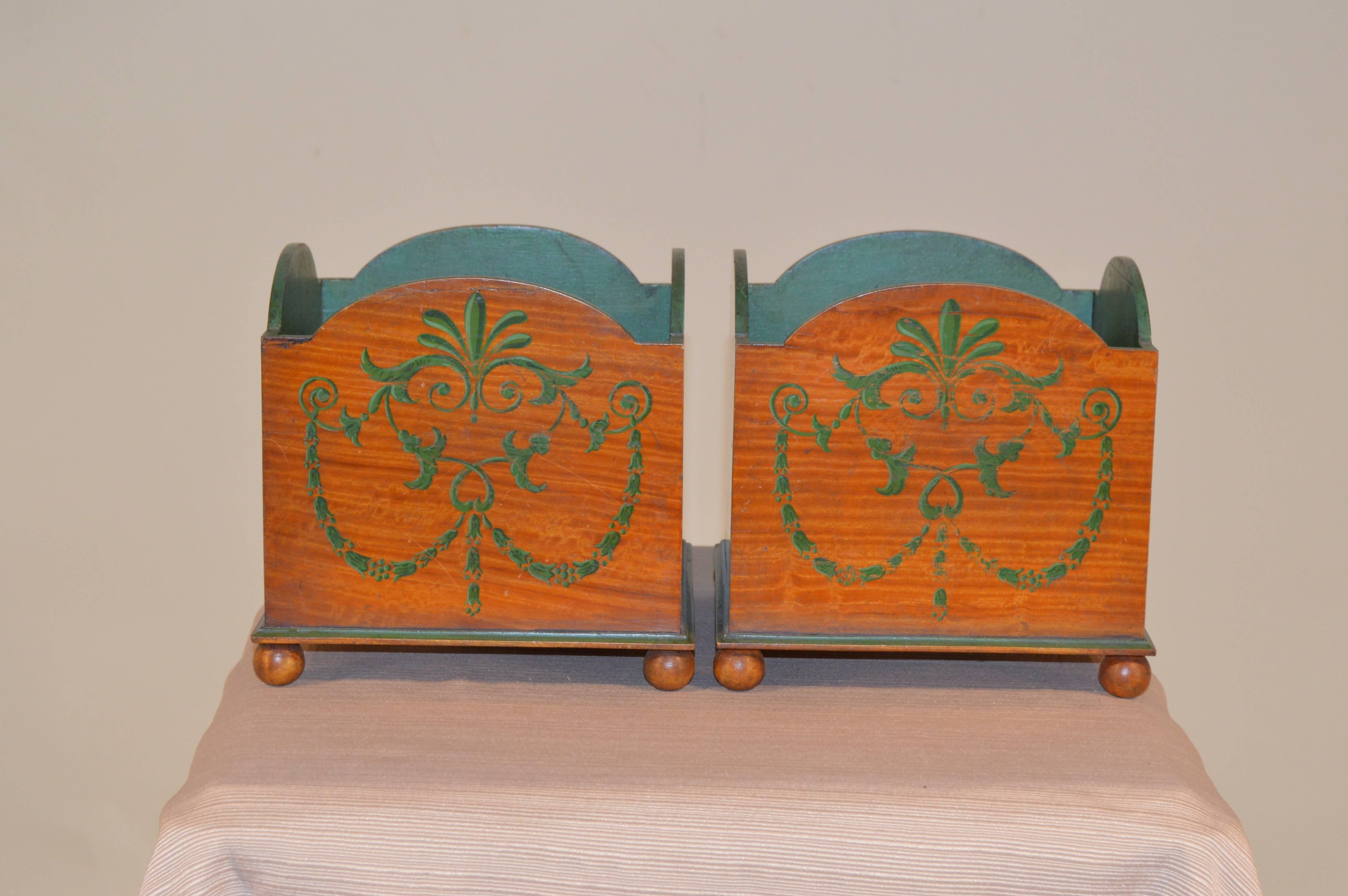 Pair of late 19th century English satinwood planters, hand-decorated with floral swags. Slight wear from use.
 