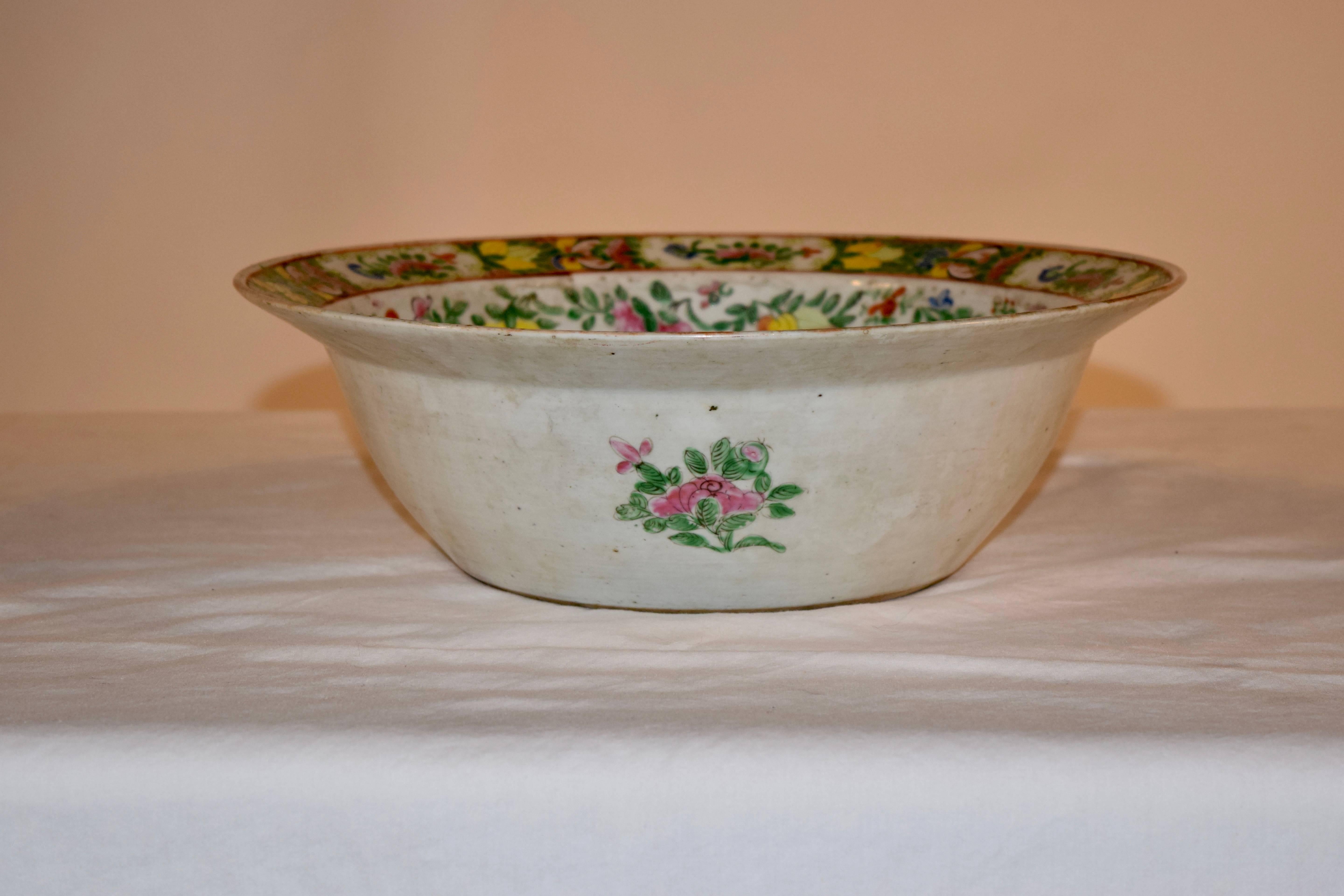 19th century hand-painted export bowl with wonderful vibrant colors in patterns of florals, birds and butterflies.