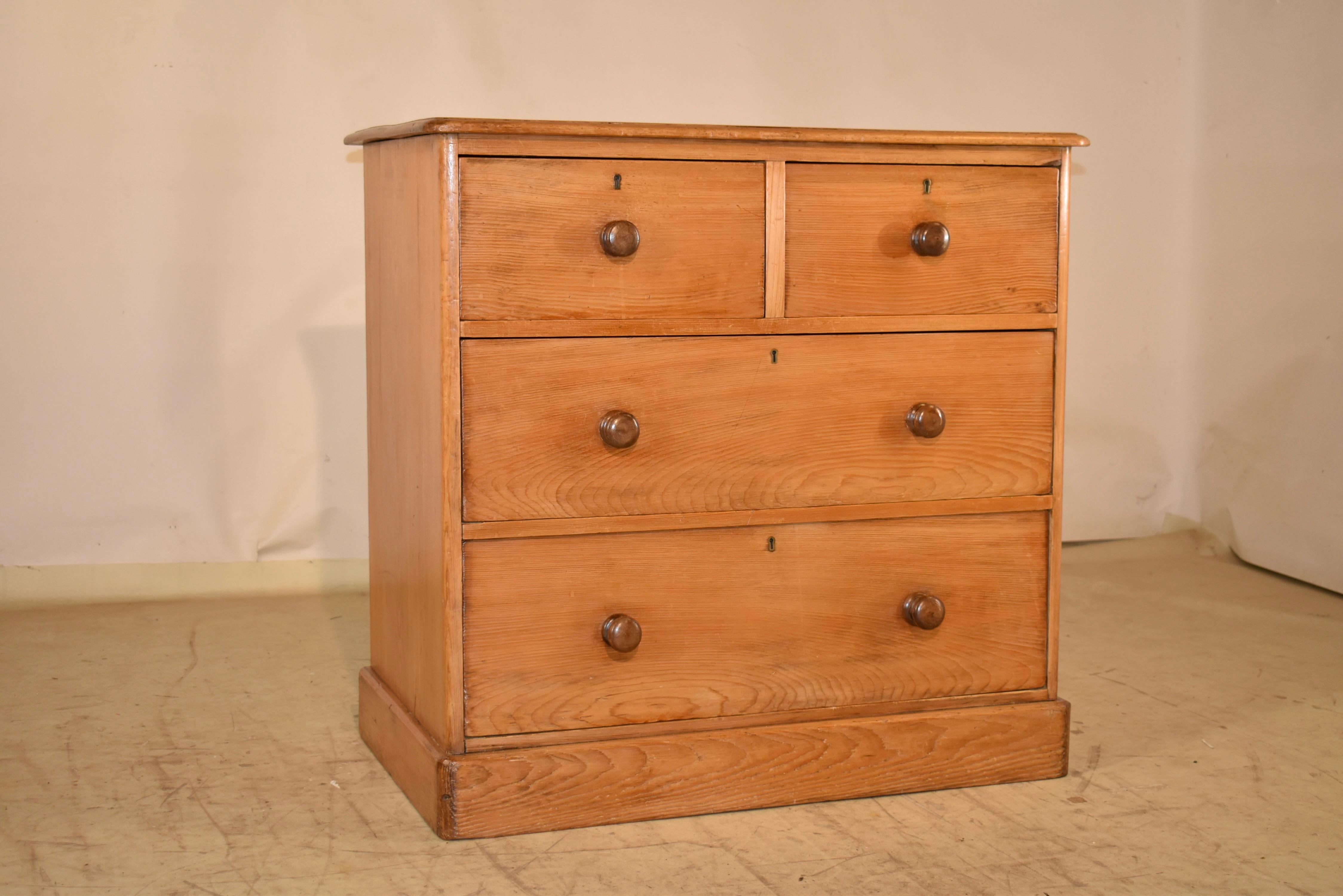 Late 18th century pine chest of drawers from England.  The top is made from one solid board and has excellent graining, and a beveled edge.  The sides are also simple and appear to be made from single boards.  The front of the case contains two