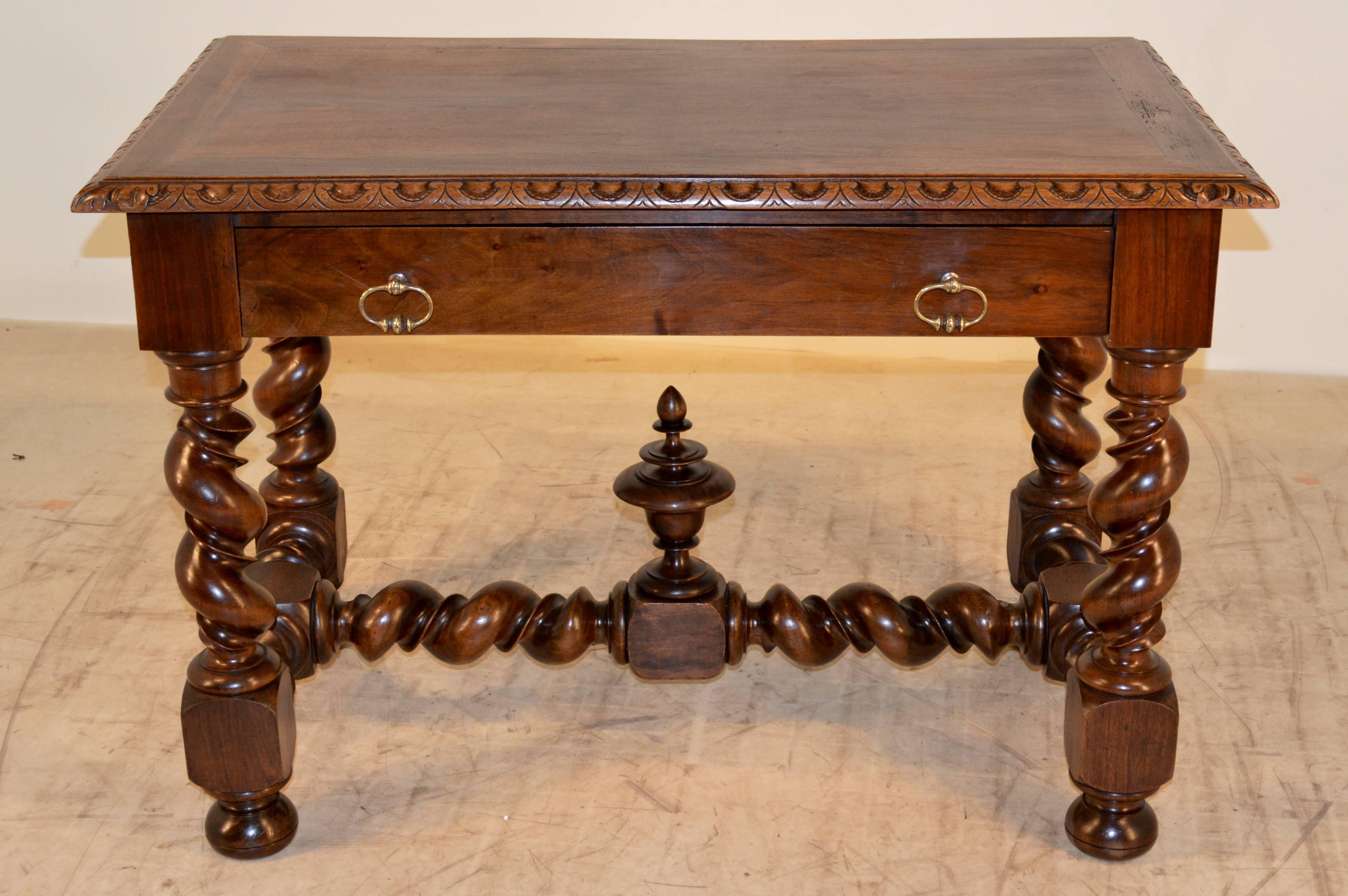 19th century French walnut side table. Banded wood top with a beveled and carved decorated edge. Single drawer in the front, and is supported on hand-turned vine twist legs with matching stretchers, finished with a lovely finial. Age wear and