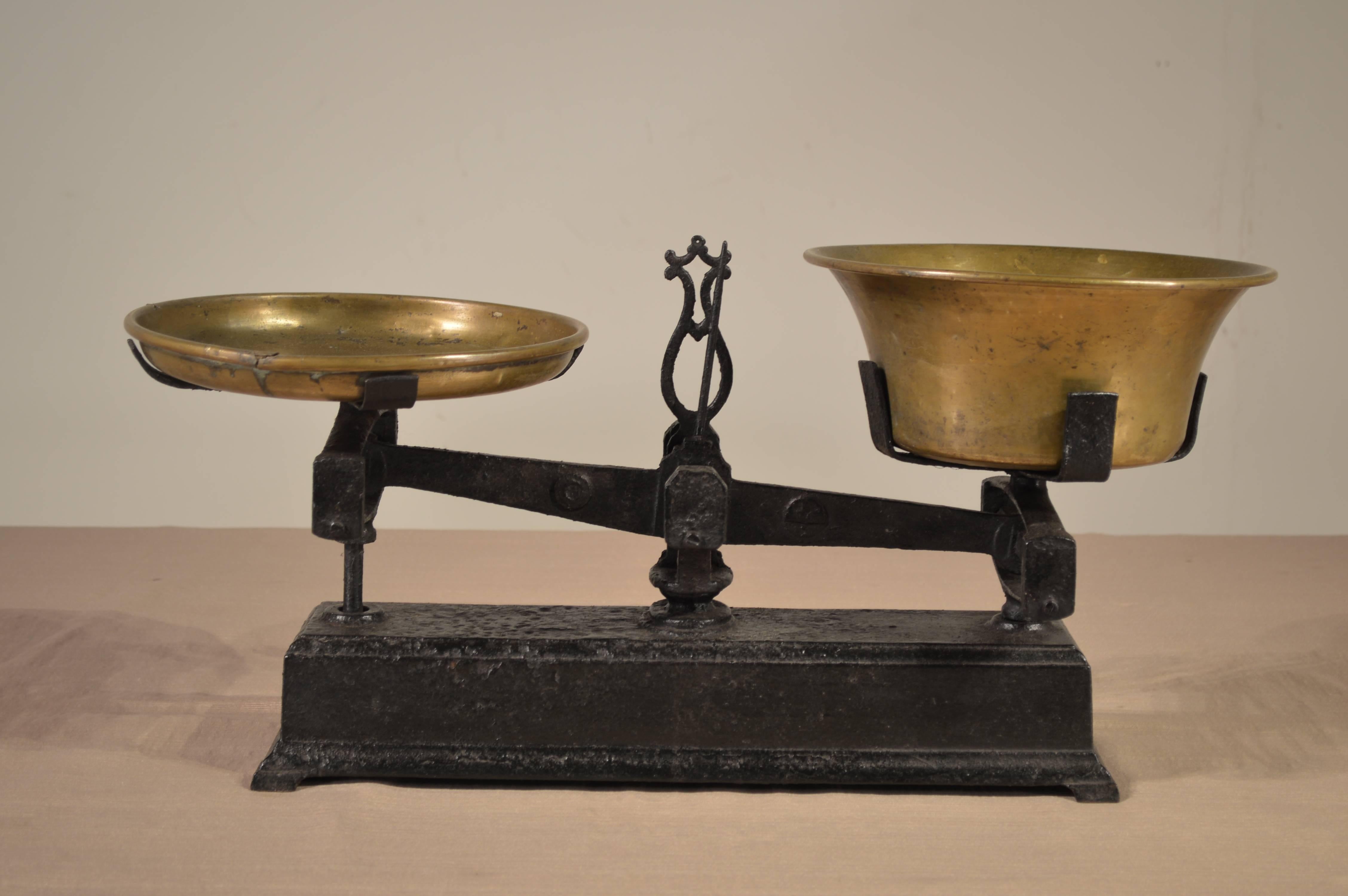 19th century French scale-made from iron with brass weighing bowls. Comes with four weights. Lovely size and proportion.