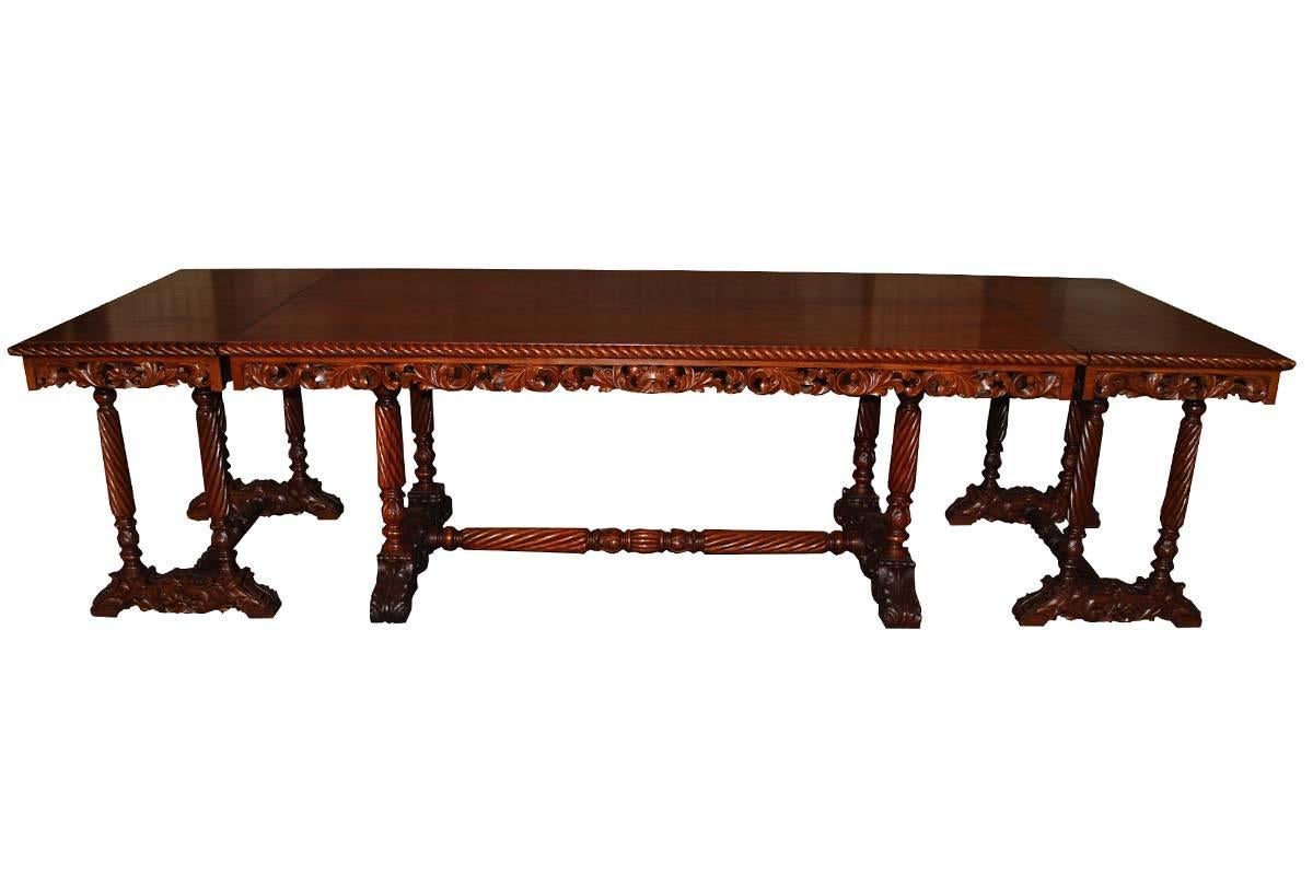 20th century. Neo Renaissance Italian hand-carved table with two matching sidetables which also can be used as extensions on each side of the table.
The table and side tables / extensions are made from mahogany. The tabletop is made from 1 single