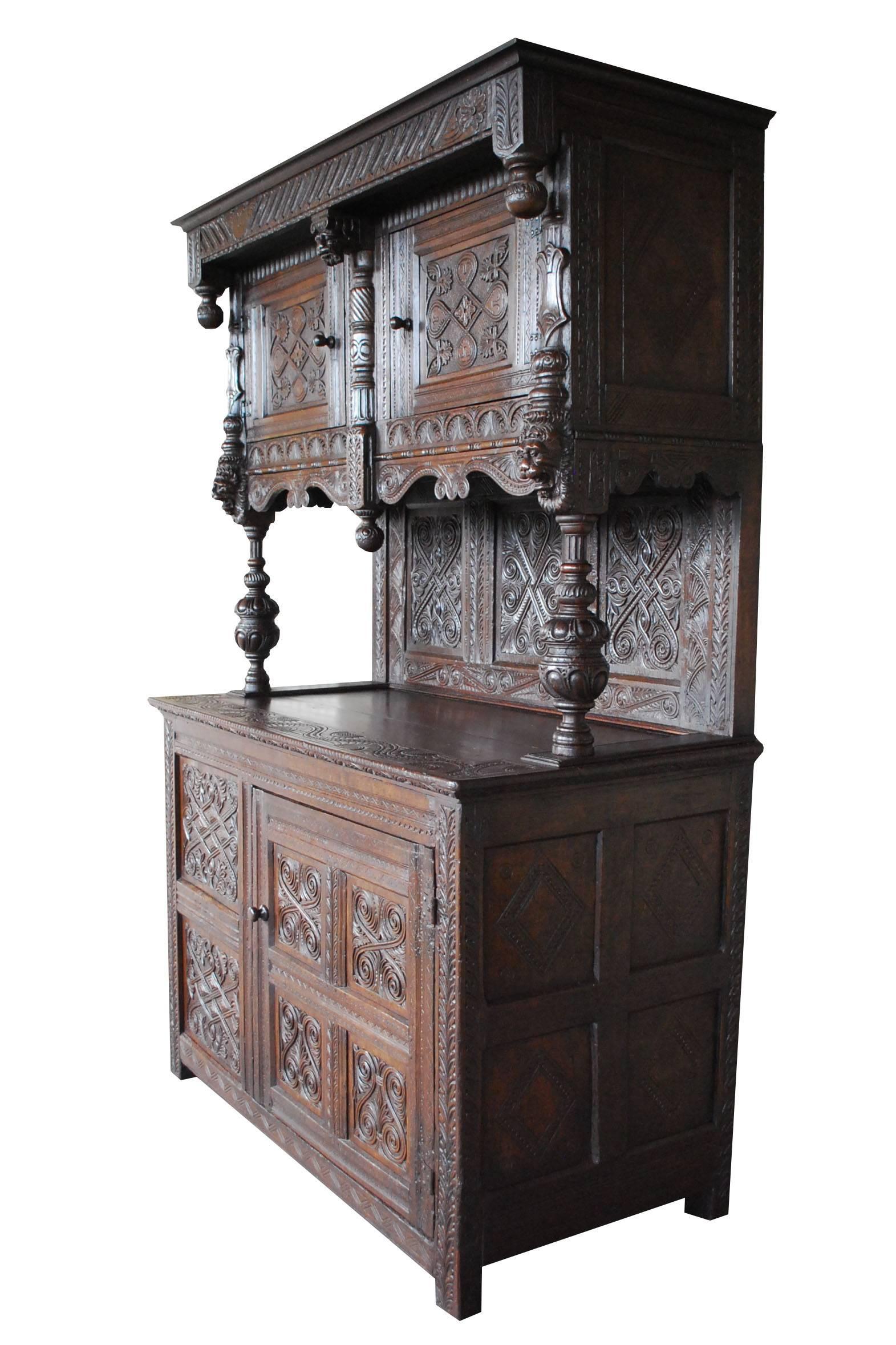 Early 19th century English carved oakwood Tudor cabinet existing of two pieces.
Originates England, dating circa 1820.