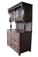 Early 19th Century English carved oakwood tudor cabinet