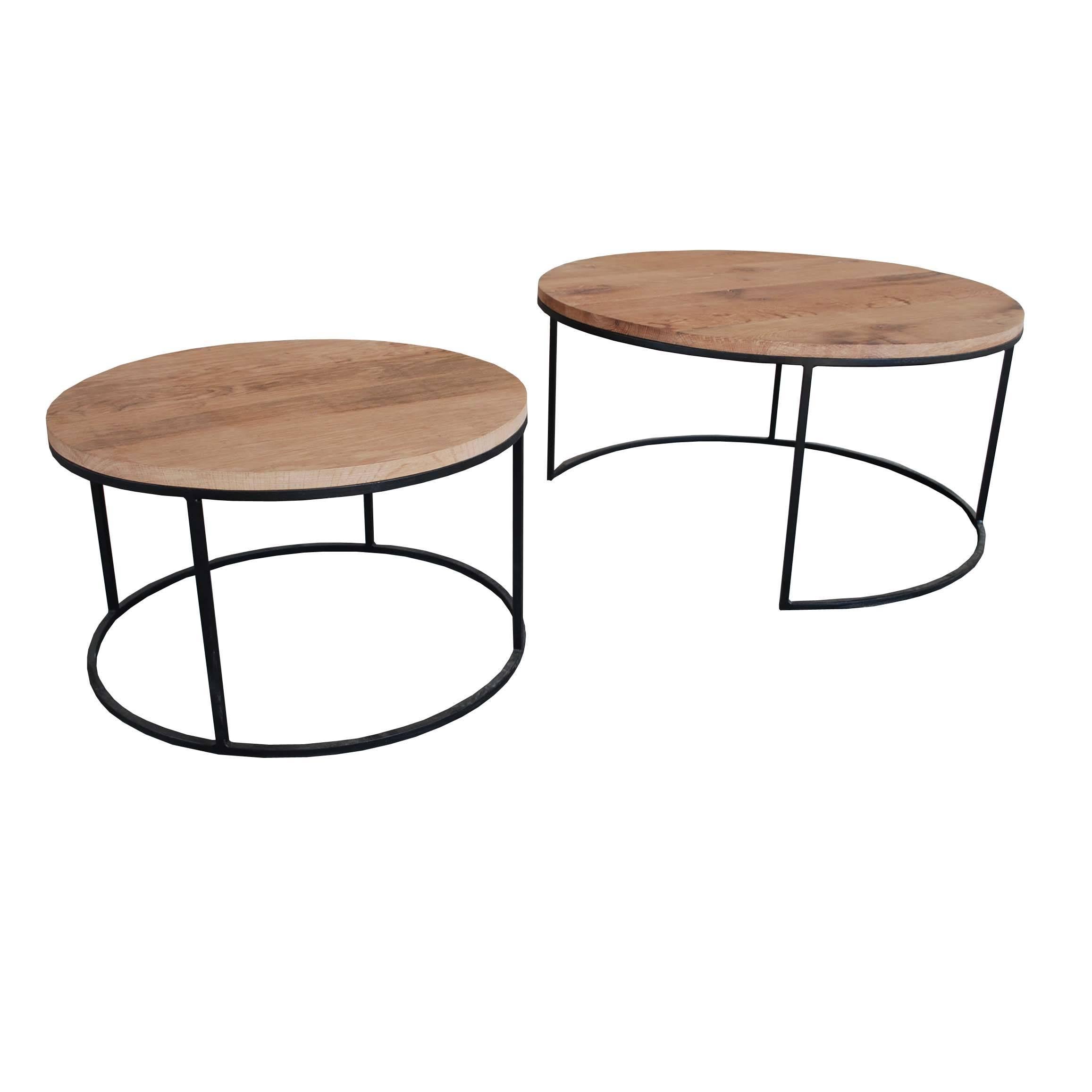 A set of two contemporary round coffeetables with solid aged oak top and solid steel base. 
The smaller table can be pushed under the larger one to create different settings.
The tops are made from aged French oak. This oakwood has undergone a