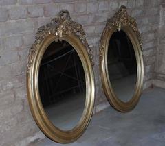 Pair of 19th Century Silver Gilded Oval Mirrors