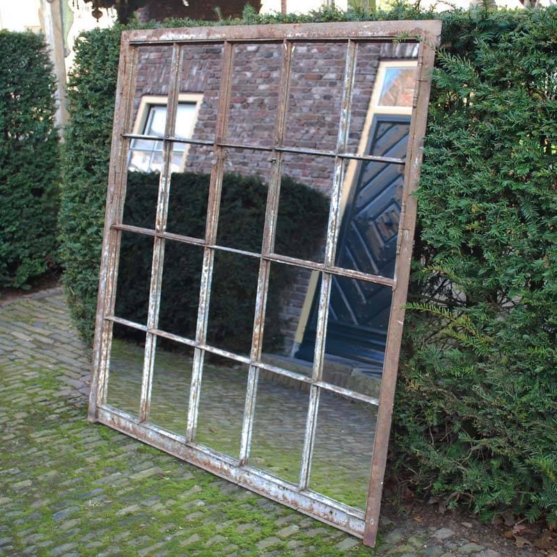 Industrial cast iron window frame with new mirrorglass. 
Excellent for restoring an old (farm)house or as Industrial mirror.
Originates France, dating circa 1880.