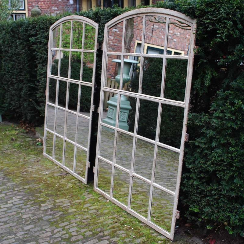 Pair of large Industrial cast iron window frames with new mirror glass. 
Excellent for restoring an old (farm) house or as Industrial mirrors. 
Originates France, dating circa 1880.