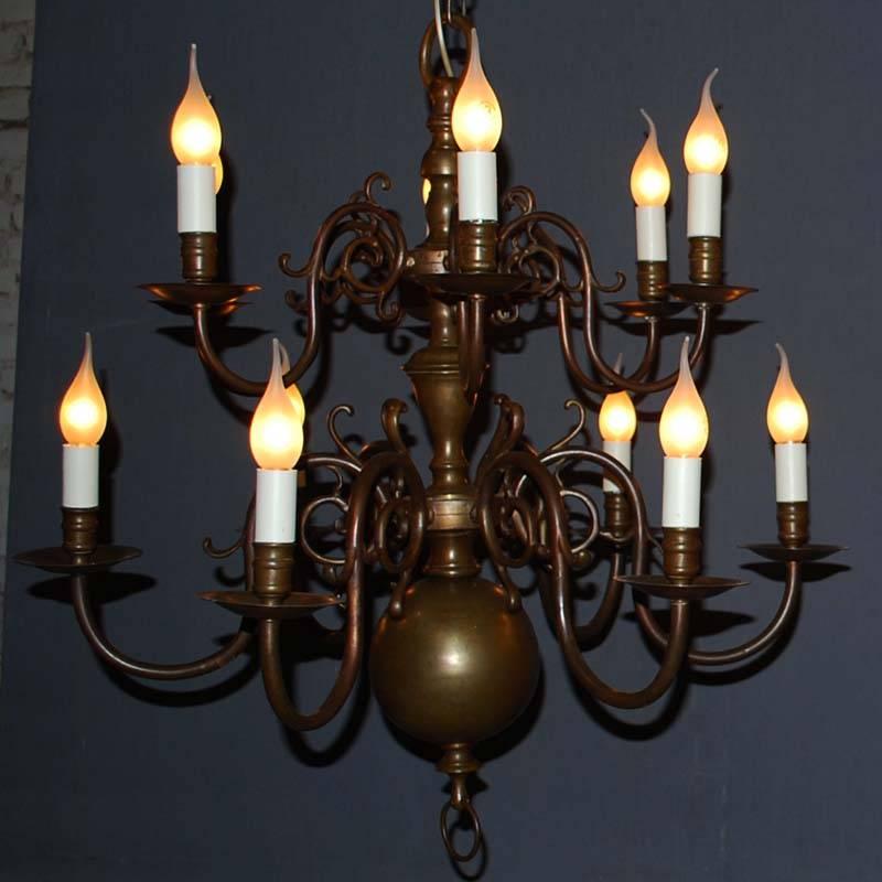 Pair of 20th century brass chandeliers.
Each chandelier has 12 lights.
Including chains and caps.
Height with chain: 158 cm, height without chain 75 cm 
Originates Netherlands, circa 1900.