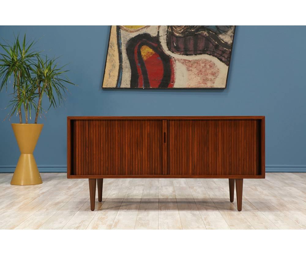 Designer: Milo Baughman
Manufacturer: Glenn of California
Period/Style: Mid-Century Modern
Country: United States
Date: 1950s

Dimensions: 23.25?H x 47.75?W x 17.75?D
Materials: Walnut wood
Condition: Excellent. Newly refinished
Number of