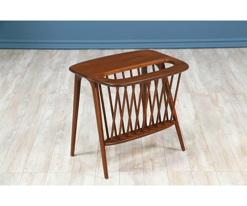 Designer: Arthur Umanoff
Manufacturer: Washington Woodcraft
Period/style: Mid-Century Modern
Country: United States
Date: 1964

Dimensions: 20.25?H x 17.75?W x 22?L
Materials: Walnut wood
Condition: Excellent, newly refinished
Number of