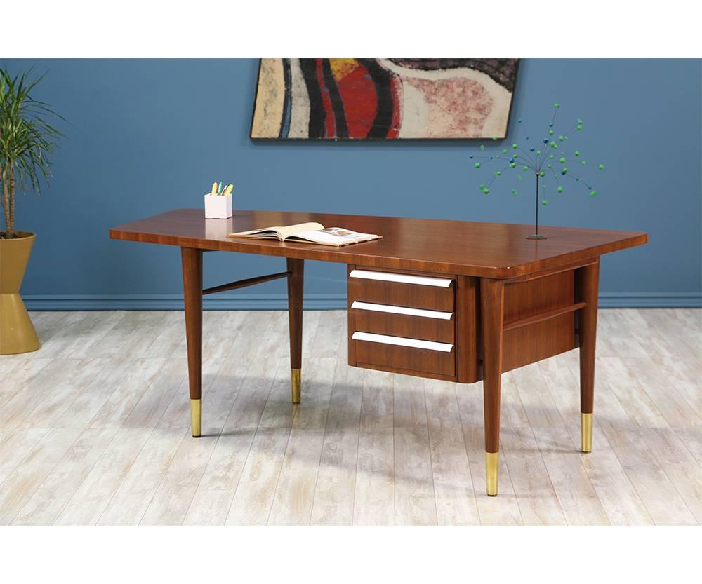Manufacturer: Stow and Davis
Period/Style: Mid-Century Modern
Country: United States
Date: 1970s

Dimensions: 29? H x 76? W x 38? D
Materials: Walnut wood, brass sabots, steel handles
Condition: Excellent – Newly Refinished
Number of Items: