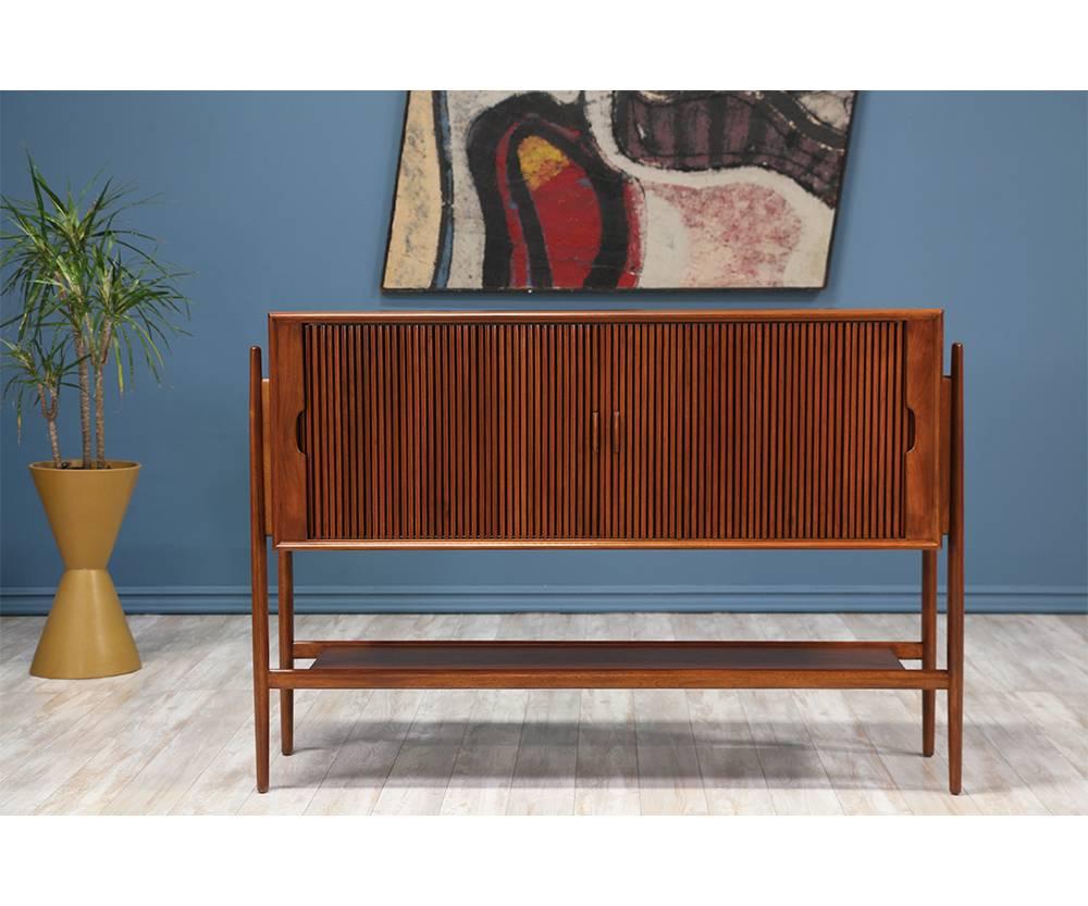 Designer: Barney Flagg
Manufacturer: Drexel “Parallel”
Period/Style: Mid-Century Modern
Country: United States
Date: 1950s

Dimensions: 36.5?H x 53.5?W x 17?D
Materials: Walnut wood
Condition: Excellent, Newly refinished
Number of items: