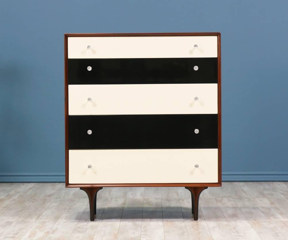 Chest of Drawers manufactured in the United States and designed by Richard Thompson for Glenn of California circa 1950’s. The playful colors and shape of the bentwood legs contrast beautifully with the simple walnut wood case. The five drawers
