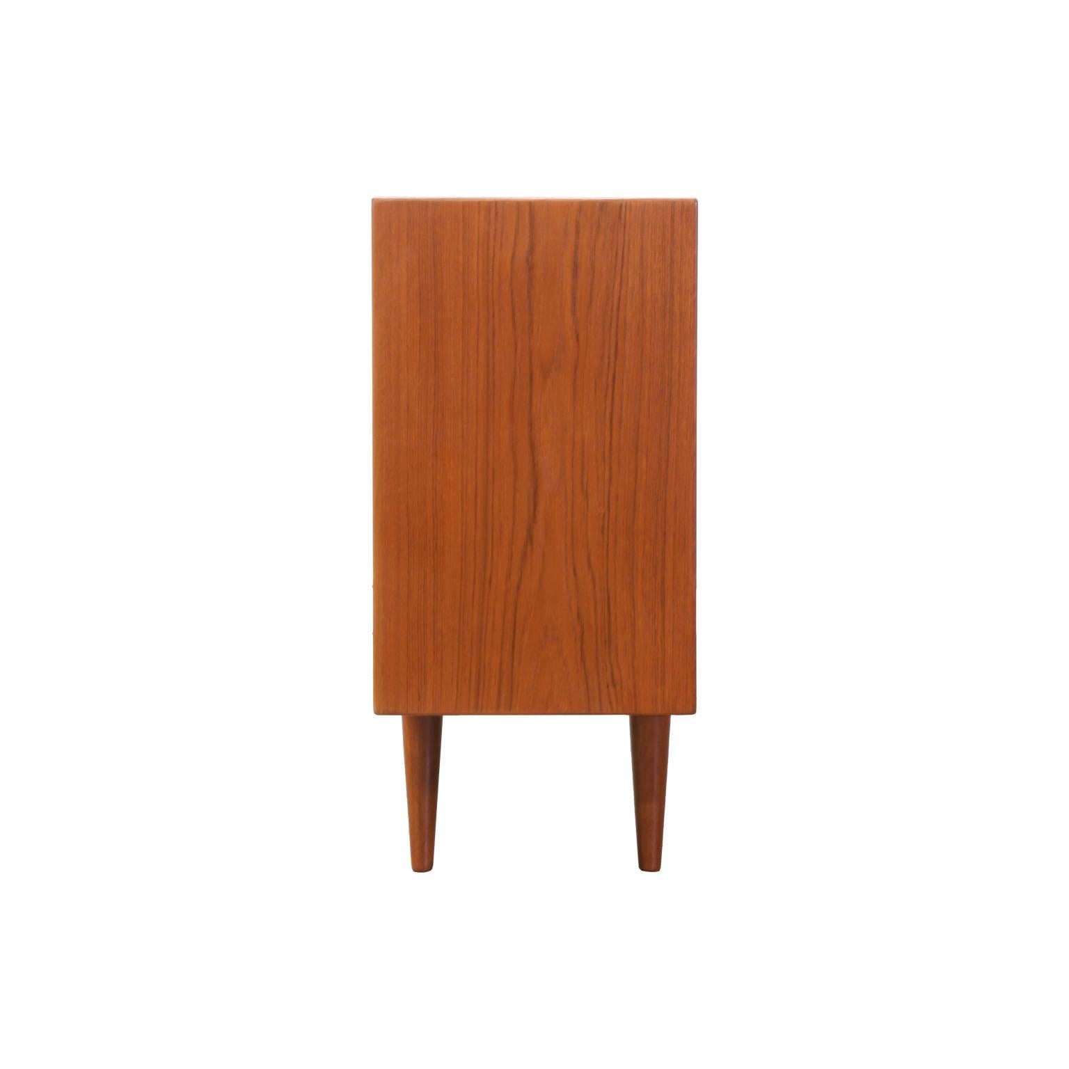Designer: Unknown
Manufacturer: Unknown
Period/Style: Danish Modern
Country: Denmark
Date: 1960’s

Dimensions: 28″H x 83″L x 12.5″W
Materials: Teak, Glass
Condition: Excellent – Newly Refinished
Number of Items: 1
ID Number: PENDING