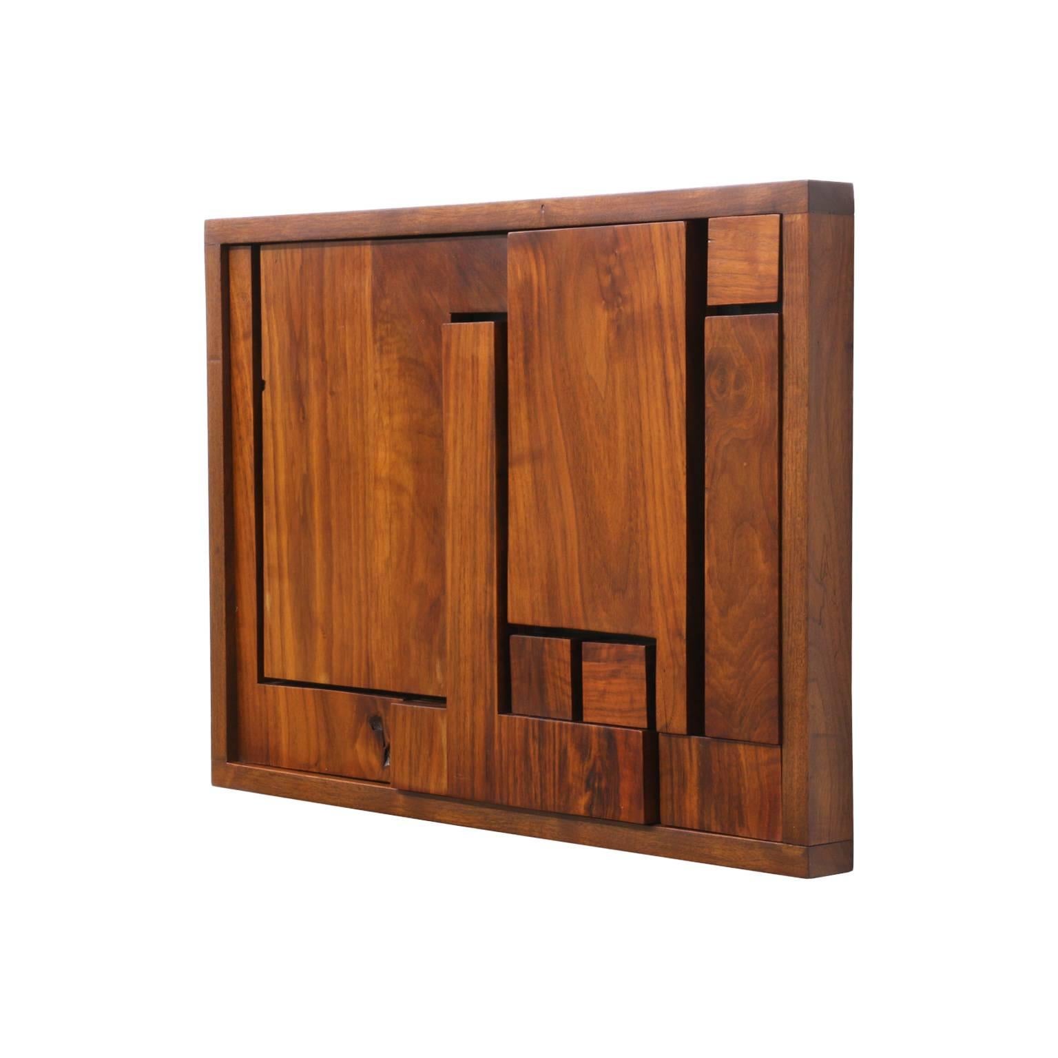 Designer: Unknown.
Manufacturer: Unknown.
Period/Style: Mid-Century Modern.
Country: United States.
Date: 1950s.

Dimensions: 16″ H x 27″ W.
Materials: Walnut.
Condition: Excellent, wear consistent with age and use.
Number of Items: 1
ID