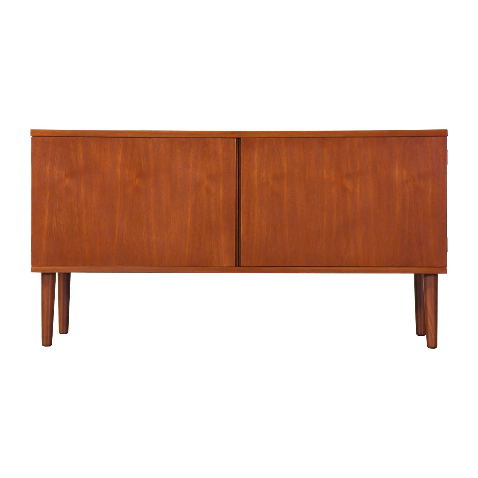 Designer: Hans Olsen.
Manufacturer: Hans Olsen Designs.
Period/Style: Danish modern.
Country: Denmark,
Date: 1960s.

Dimensions: 26.5″ H x 50″ L x 16″ W.
Materials: Teak.
Condition: Excellent, newly refinished.
Number of items: One.
ID