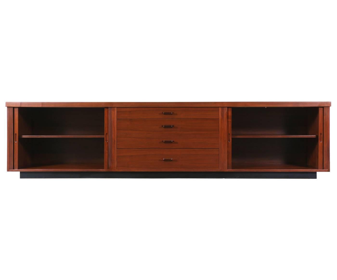 Designer: Glenn of California
Manufacturer: Glenn of California
Period/Style: Mid Century Modern
Country: Unites States
Date: 1950s

Dimensions: 26.25″H x 108.75″L x 18.75″W
Materials: Walnut, Black Laminate Top
Condition: Excellent – Newly