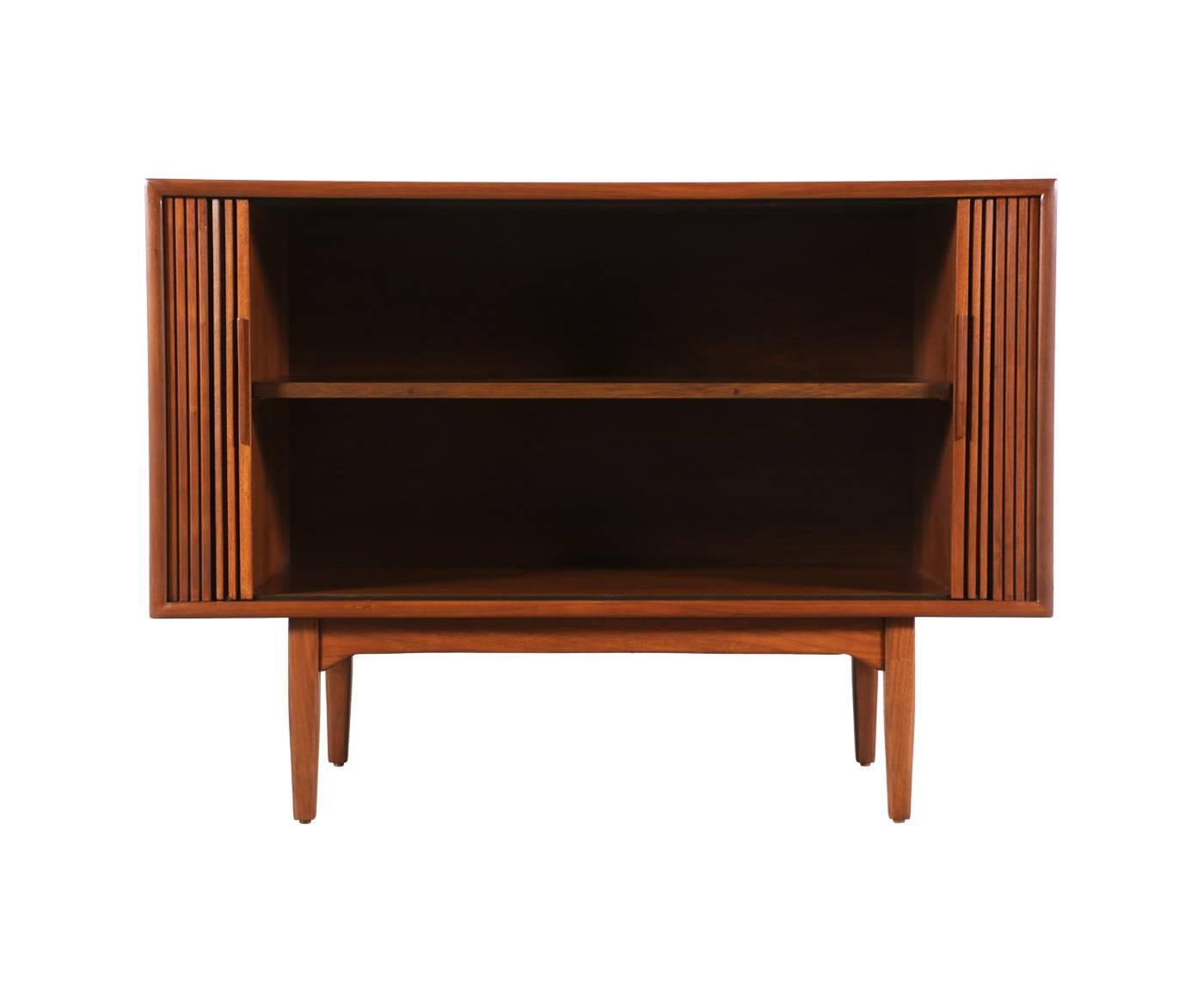 Designer: Stewart McDougall & Kipp Stewart.
Manufacturer: Drexel “Declaration.”
Period/Style: Mid-Century Modern.
Country: United States.
Date: 1950s.

Dimensions: 31.5″ H x 43.5″ W x 19.25″ D.
Materials: Walnut.
Condition: Excellent newly