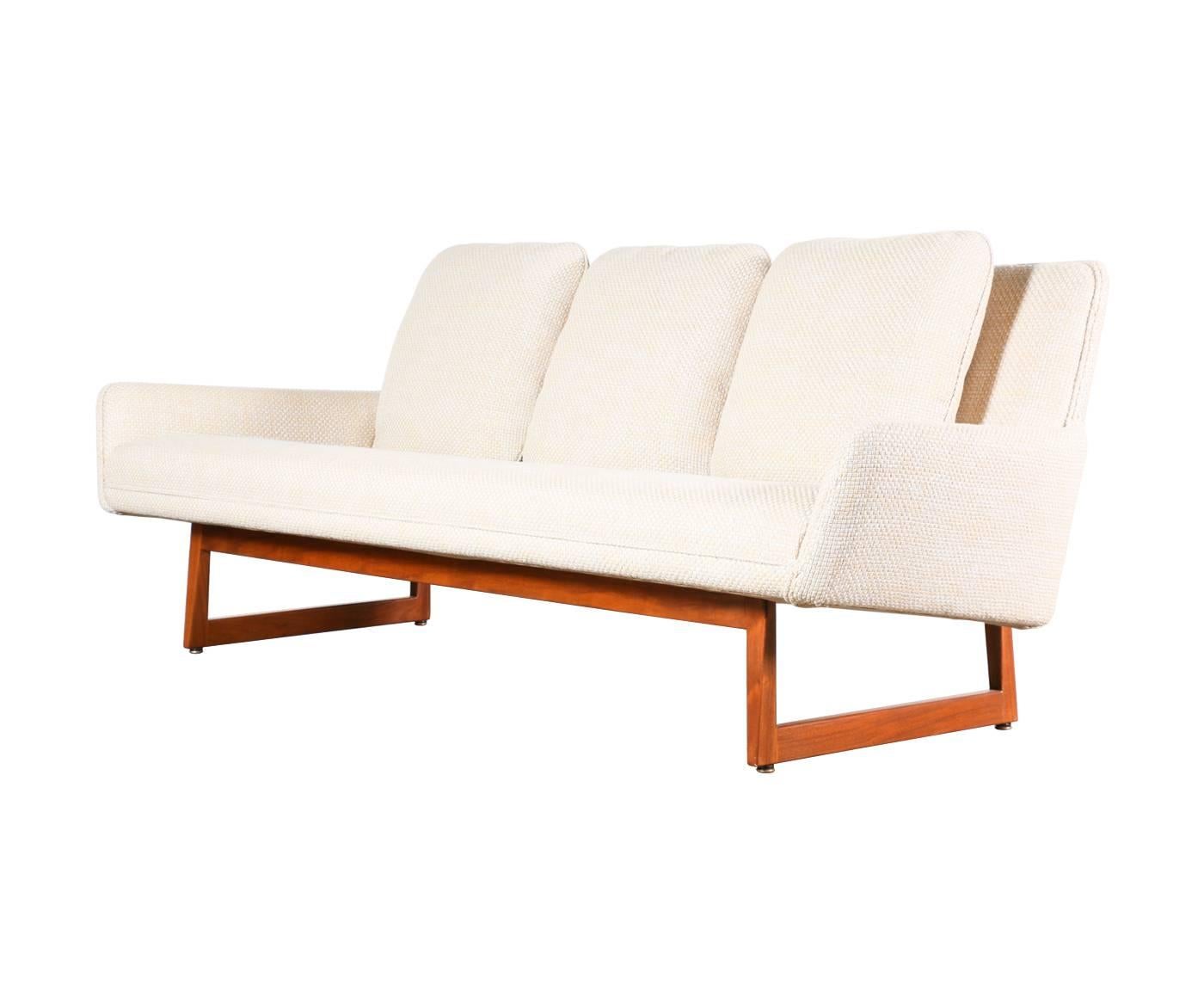 Designer: Jens Risom.
Manufacturer: Jens Risom design.
Period/Style: Mid-Century Modern.
Country: United States.
Date: 1960s.

Dimensions: 30.25″ H x 84.5″ L x 35″ W.
Materials: Walnut, cotton tweed.
Condition: Excellent, newly refinished