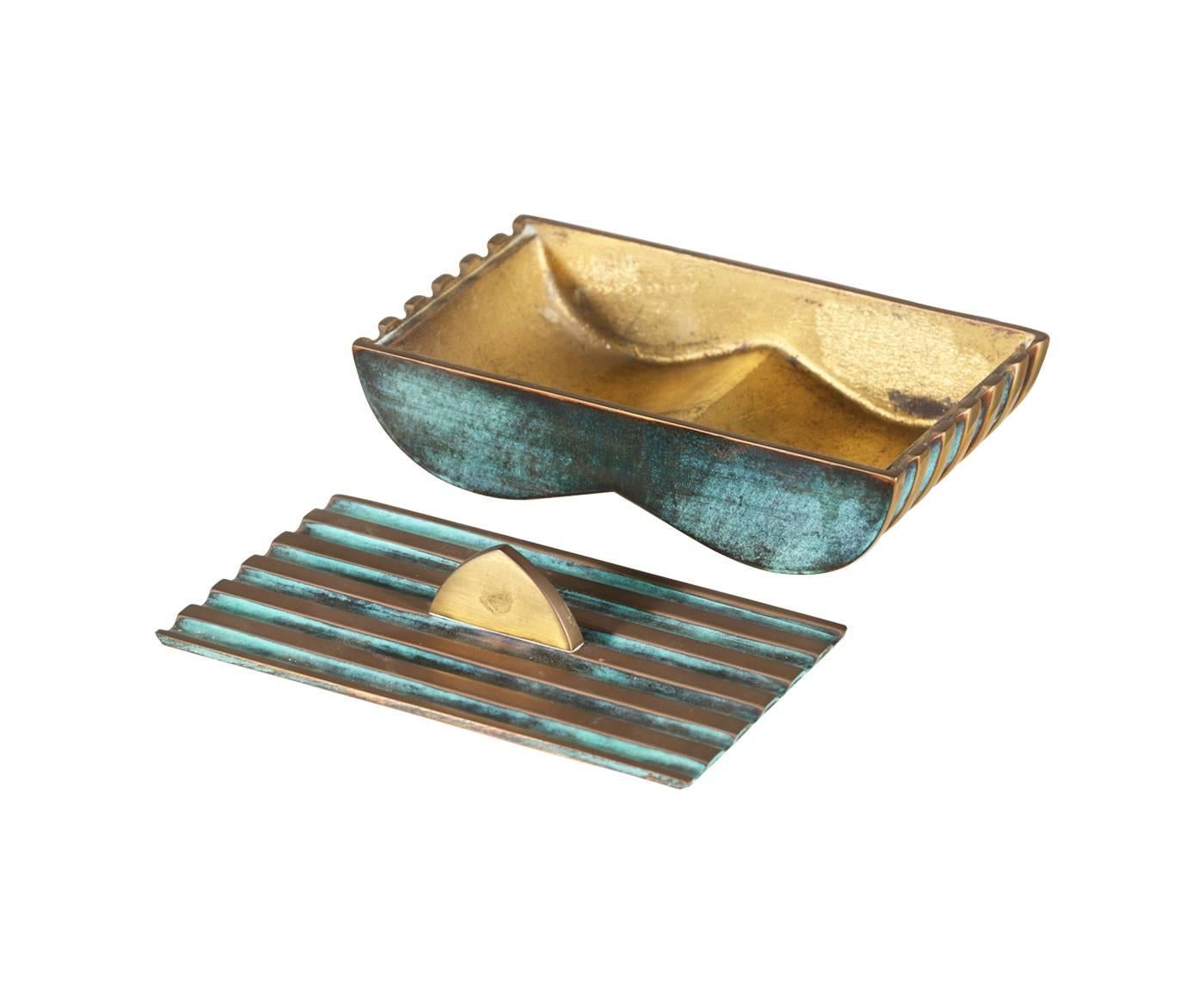Designer: Maurice Ascalon.
Manufacturer: Pal-Bell.
Period/Style: Art Deco.
Country: Israel.
Date: 1950s.

Dimensions: 3″ H x 6.75″ W x 3.75″ D.
Materials: Heavy verdigris bronze showing a beautiful patina
Condition: Shows minor wear