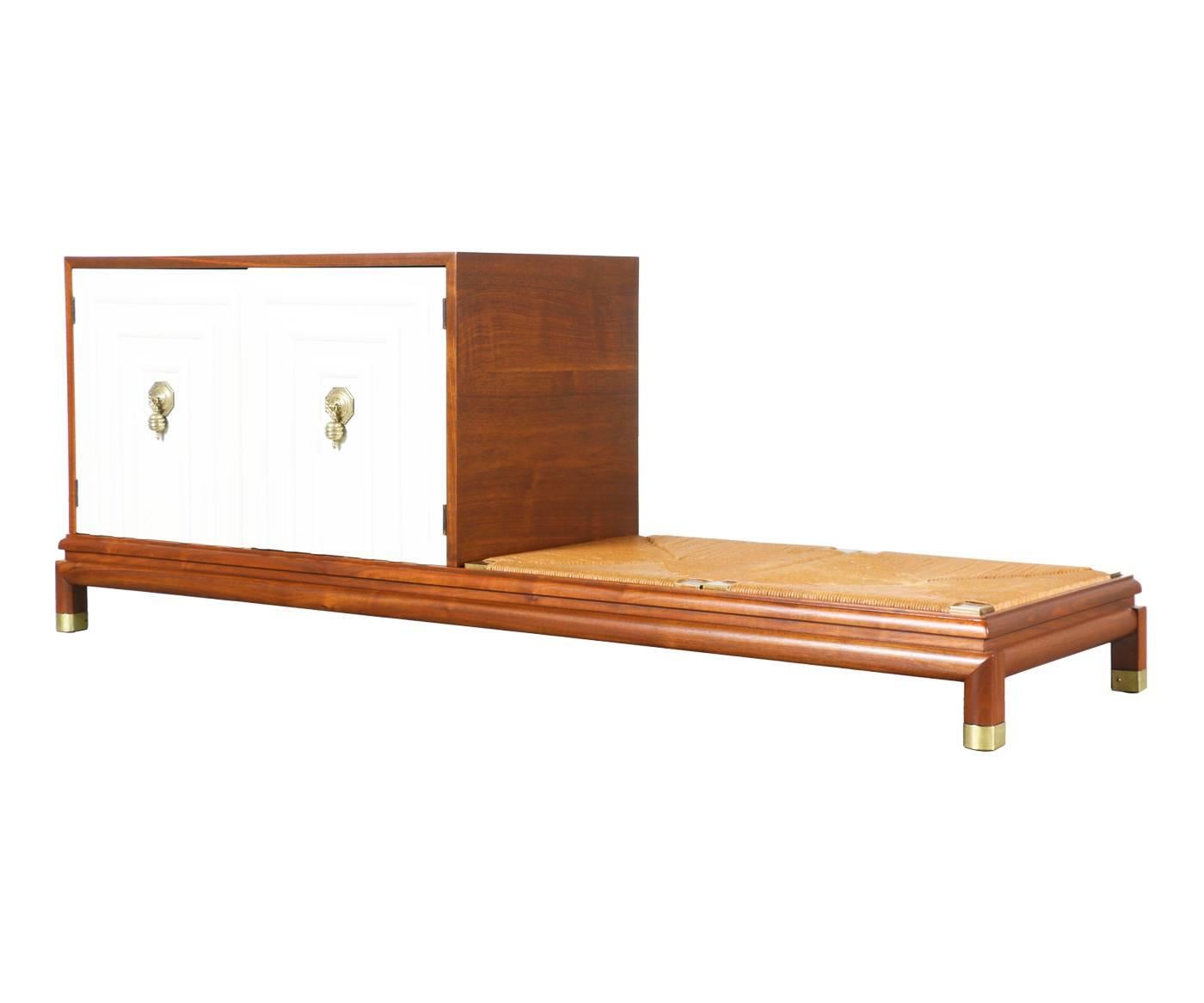 Designer: Renzo Rutili.
Manufacturer: Johnson Furniture.
Period/style: Mid-Century Modern.
Country: United States.
Date: 1960s.

Dimensions: 25″ H x 67.5″ L x 19″ W.
Materials: Walnut, lacquered wood, rush chord, brass.
Condition: Excellent,
