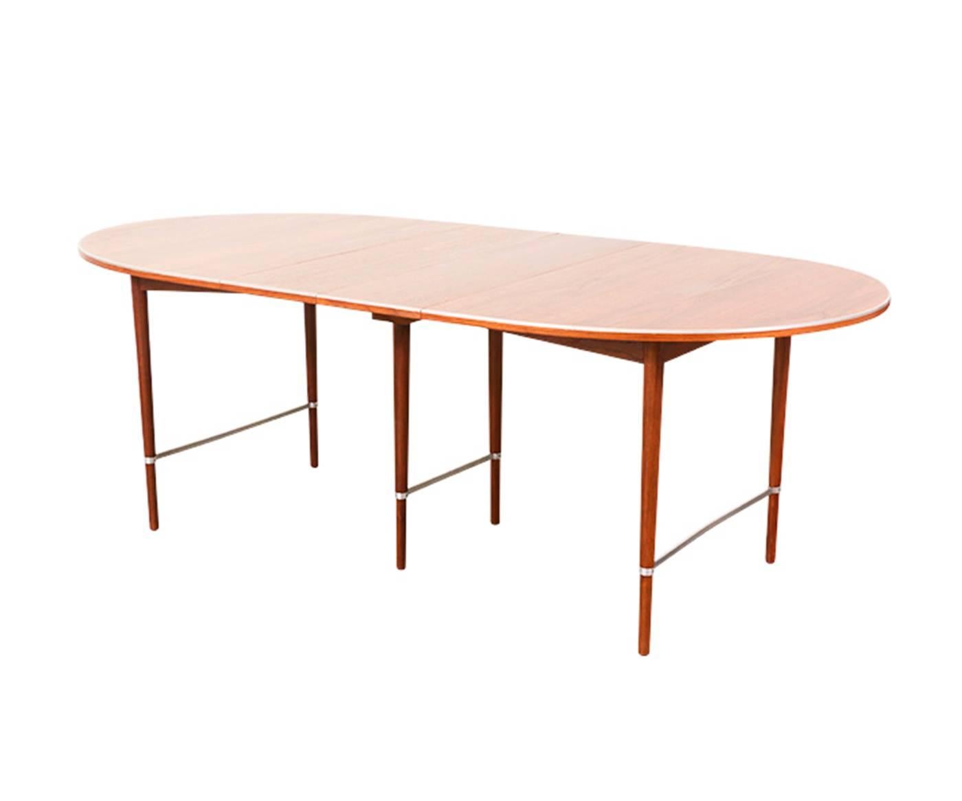 Designer: Paul McCobb.
Manufacturer: H. Sacks & Sons “Connoisseur.”
Period/style: Mid-Century Modern.
Country: United States.
Date: 1950s.

Dimensions: 19.25“ H x 62“ L x 41” W.
Each extension leaf expands 11″. Table expands 62″ –