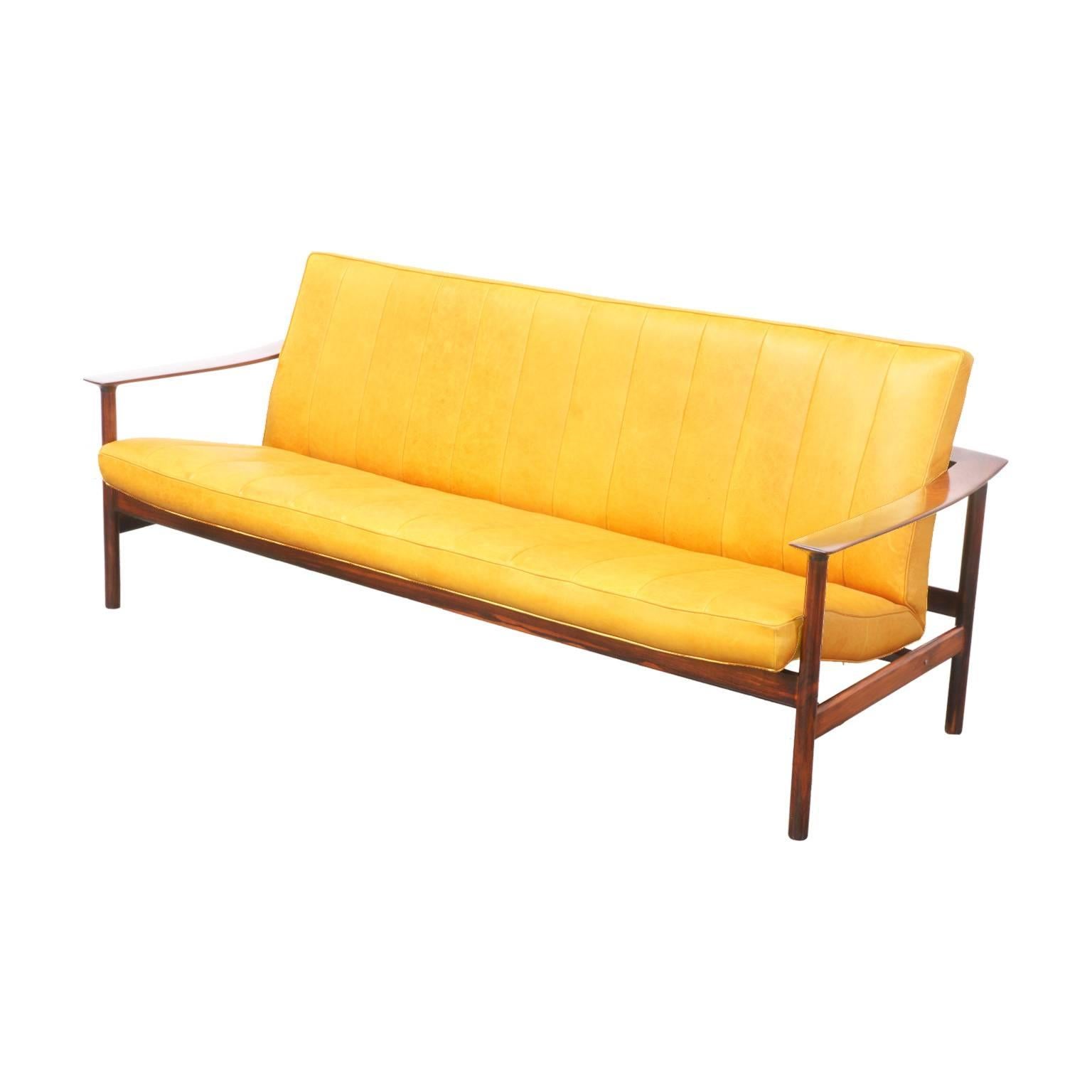 Designer: Sven Ivar Dysthe.
Manufacturer: Dokka Mobler.
Period/Style: Scandinavian Modern.
Country: Norway.
Date: 1960s.

Dimensions: 30.75″ H x 73.5″ W x 29″ D.
Seat height 15″.
Materials: Rosewood, leather.
Condition: Excellent – Newly