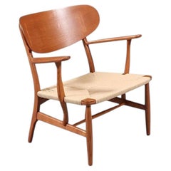 Restaurata con maestria - Poltrona CH-22 di Hans J. Wegner per Carl Hansen & Søn