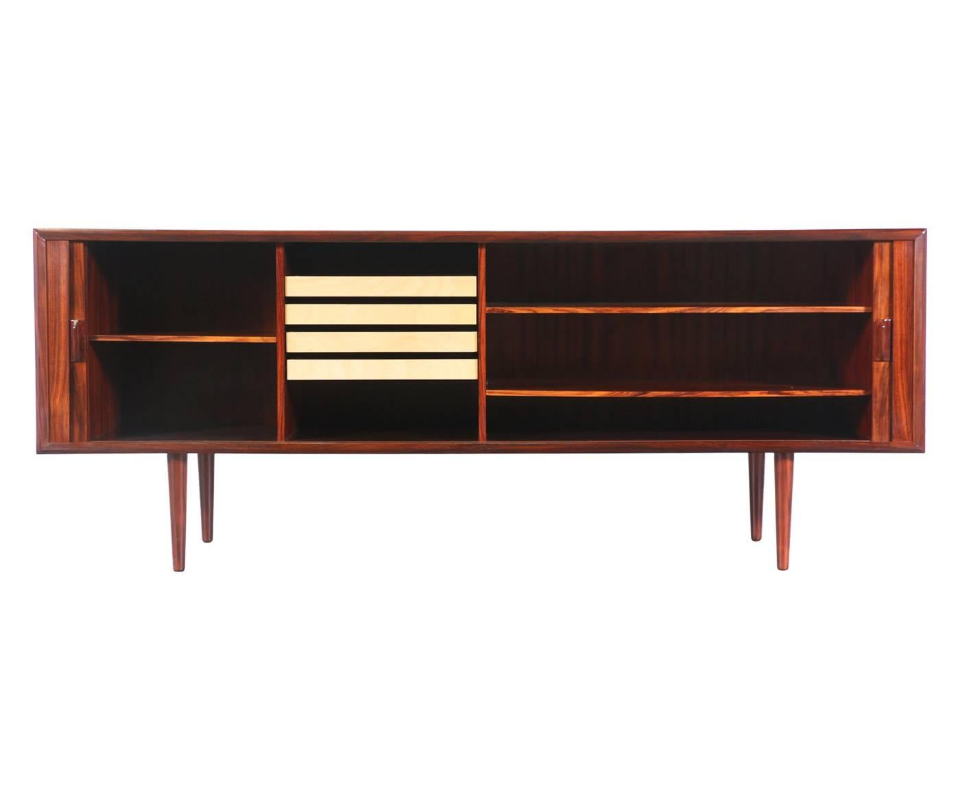 Designer: Svend A. Larsen.
Manufacturer: Faarup Møbelfabrik.
Period/style: Danish modern.
Country: Denmark.
Date: 1950s.

Dimensions: 31.25″ H x 79.75″ W x 19″ D.
Materials: Rosewood.
Condition: Excellent, newly refinished.
Number of items: