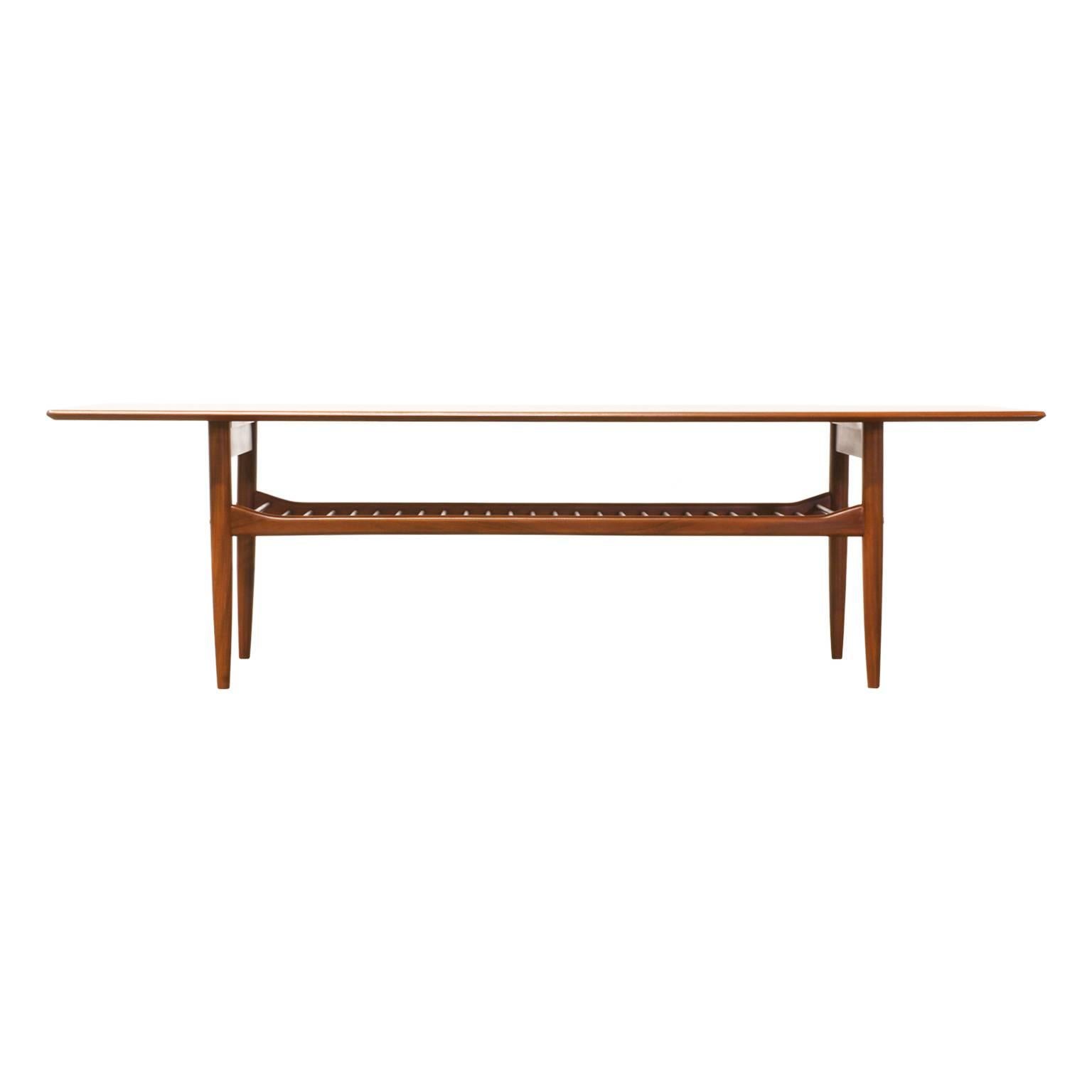 Designer: Ib Kofod Larsen.
Manufacturer: G-Plan.
Period/Style: Mid-Century Modern.
Country: England.
Date: 1960s.

Dimensions: 65.75″ L x 23″ W x 18″ H.
Materials: Teak.
Condition: Excellent, newly refinished.
Number of items: 1.
ID