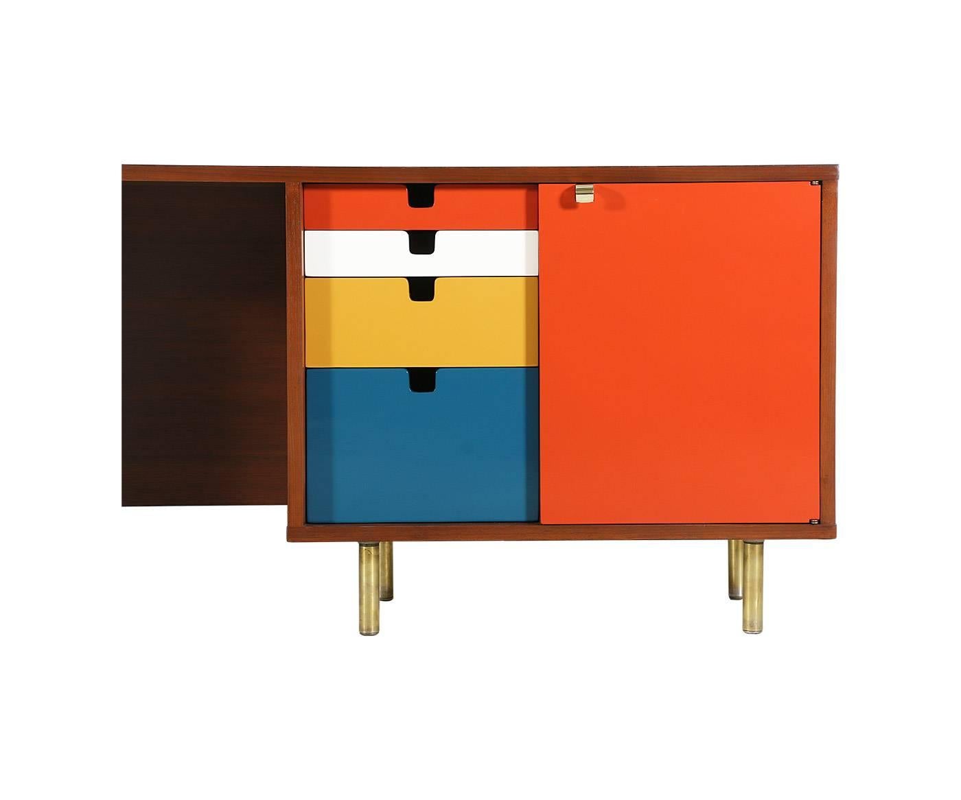 Designer: George Nelson.
Manufacturer: Herman Miller.
Period/Style: Mid-Century Modern.
Country: United States.
Date: 1950s.

Dimensions: 25.5″H x 80″L x 18.5″W.
Materials: Walnut, brass, lacquer.
Condition: Excellent, newly