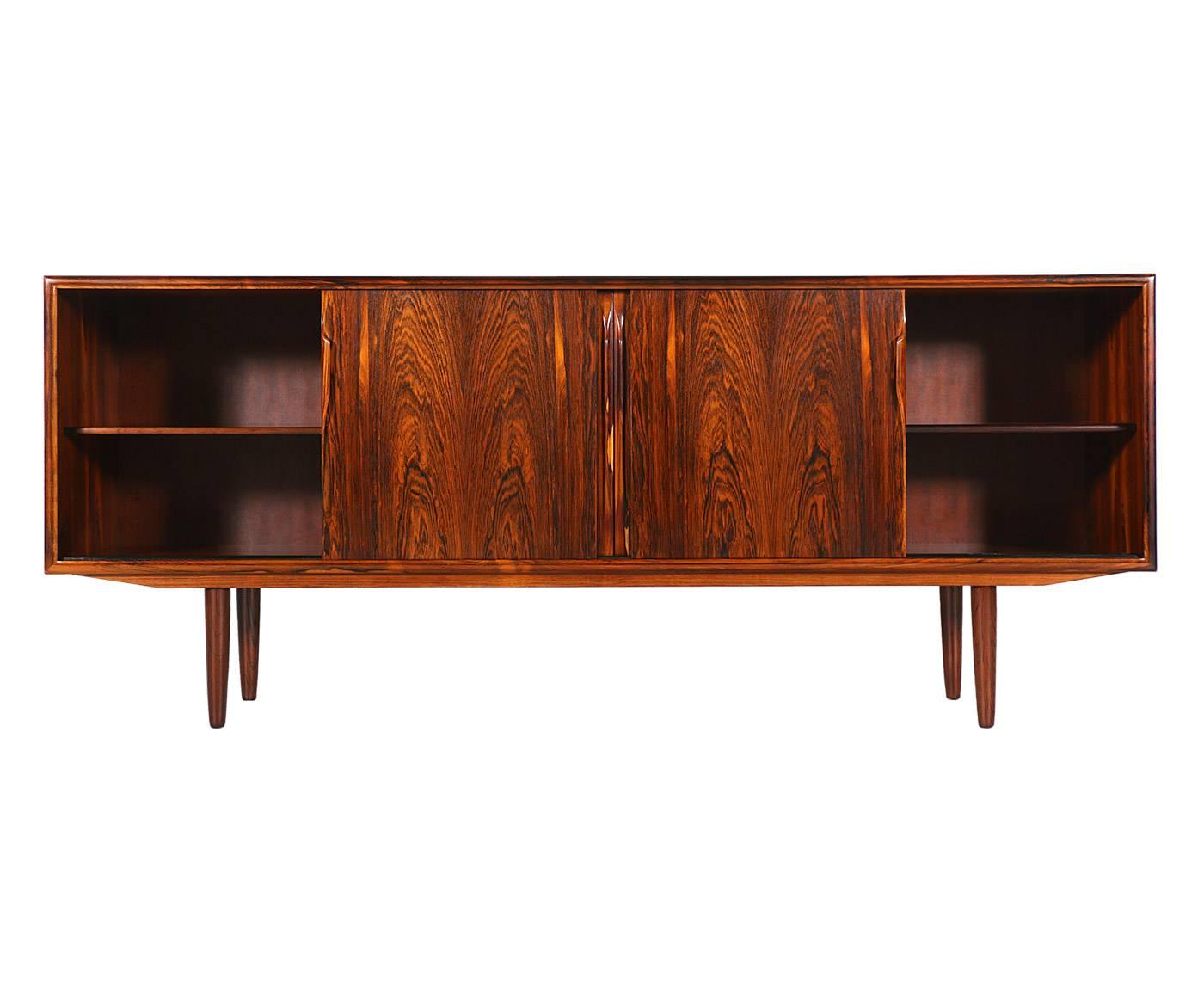 Designer: Axel Christensen.
Manufacturer: Axel Christensen.
Period/Style: Danish Modern.
Country: Denmark.
Date: 1950s.

Dimensions: 32.5″H x 78.75″L x 18″W.
Materials: Brazilian rosewood.
Condition: Excellent, newly refinished.
Number of