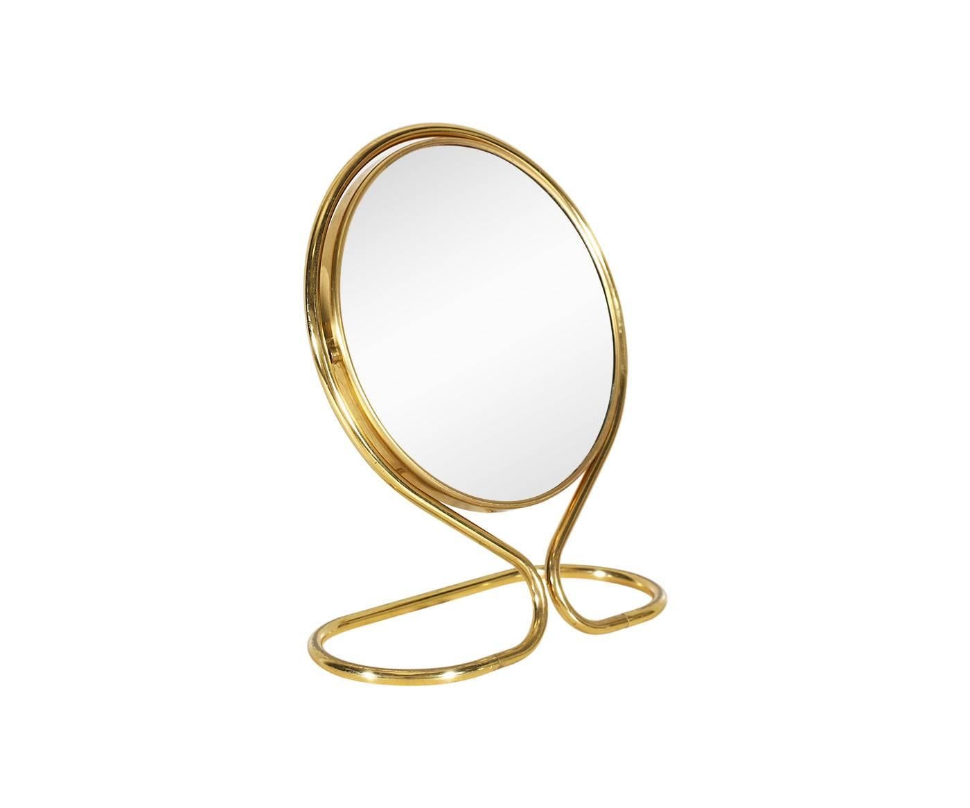 Period/style: Mid-Century Modern.
Country: United States.
Date: 1960s.

Dimensions: 9″ H x 8.5″ W x 5″ D.
Materials: Brass, original mirror shows some wear.
Condition: Shows minimal wear from age and use.
Number of items: One.
Id number: