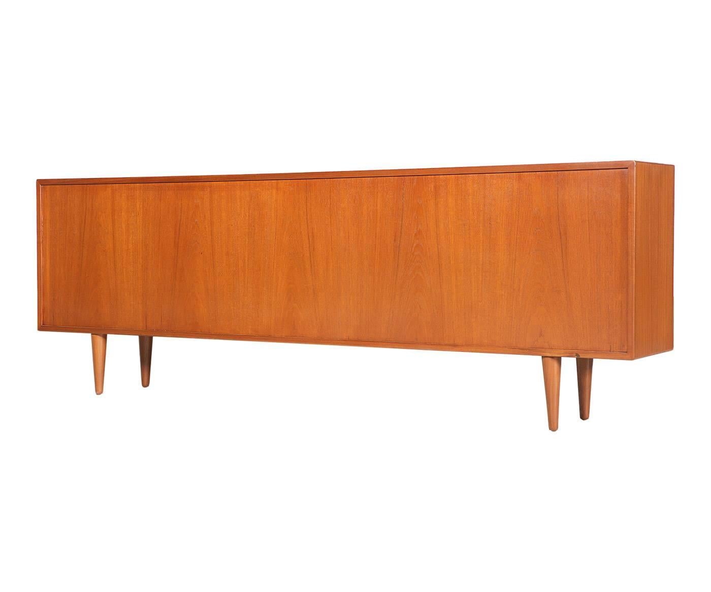 Period/Style: Danish Modern.
Country: Denmark.
Date: 1960s.

Dimensions: 28.25″ H x 82.75″ L x 12.25″ W.
Materials: Teak, new glass doors.
Condition: Excellent – newly refinished & new glass doors.
Number of items: 1.
ID number: 4682.
