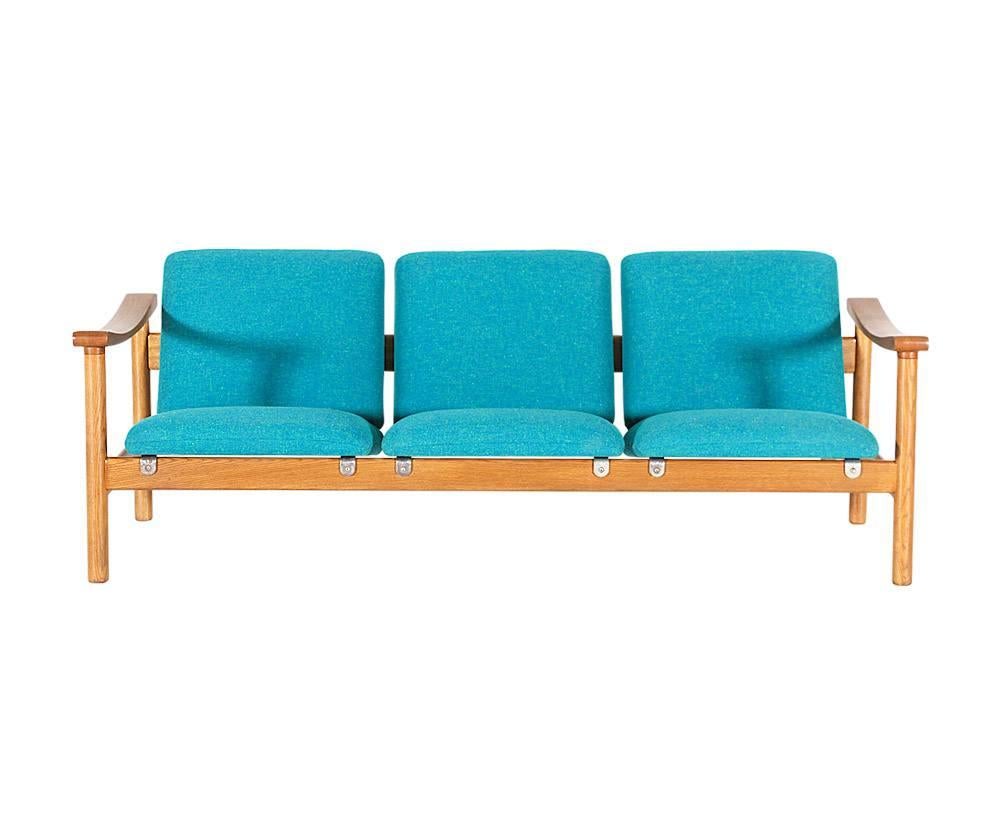 Designer: Hans J. Wegner
Manufacturer: GETAMA
Period/Style: Danish Modern
Country: Denmark
Date: 1970s

Dimensions: 25.5 H x 70 L x 26.5 D
Seat Height 14.75
Materials: oakwood, tweed upholstery, steel hardware
Condition: Excellent, newly
