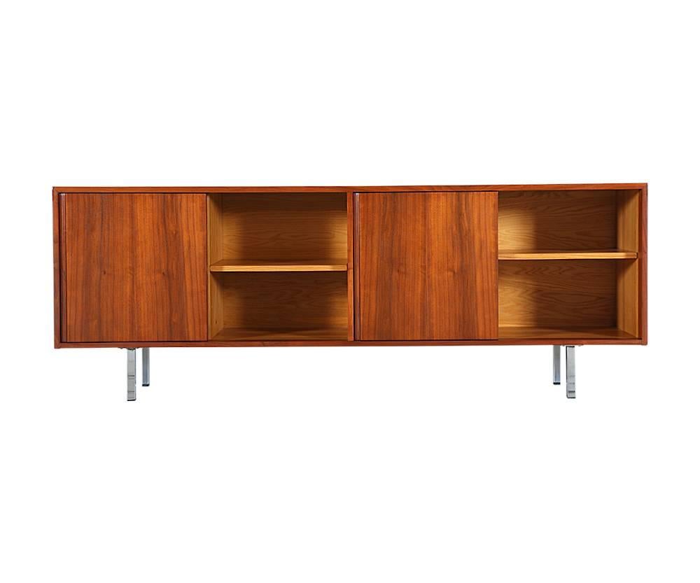 Designer: Florence Knoll
Manufacturer: Florence Knoll Inc.
Period/style: Mid-Century Modern
Country: United States
Date: 1950s

Dimensions: 27 H x 18 W x 73 L
Materials: Walnut wood, chrome legs
Condition: Excellent, newly refinished
Number