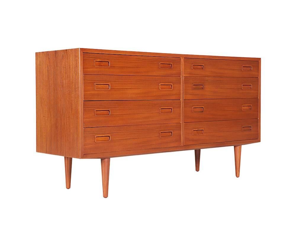 Designer: Poul Hundevad
Manufacturer: Poul Hundevad & Co.
Period/style: Danish modern
Country: Denmark
Date: 1950s

Dimensions: 29.75 H x 54.5 W x 17 D
Materials: Teak wood
Condition: Excellent, newly refinished
Number of items: One
ID