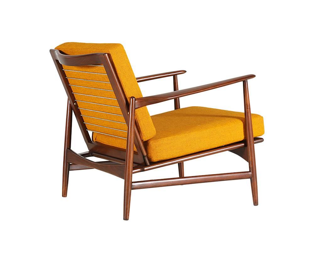 Designer: Ib Kofod-Larsen
Manufacturer: Selig
Period/Style: Danish Modern
Country: Denmark
Date: 1950s

Dimensions: 28 H x 29.5 W x 32 D
Seat height 15.5
Materials: African teak, sculpted foam upholstered in leather
Condition: Excellent,