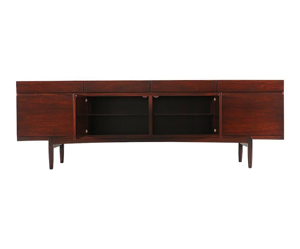 Designer: Ib Kofod Larsen
Manufacturer: Faarup Møbelfabrik
Period/style: Danish modern
Country: Denmark
Date: 1950s

Dimensions: 30.5 H x 90.5 L x 19.5 W
Materials: Rosewood
Condition: Excellent, newly refinished
Number of items: One
ID