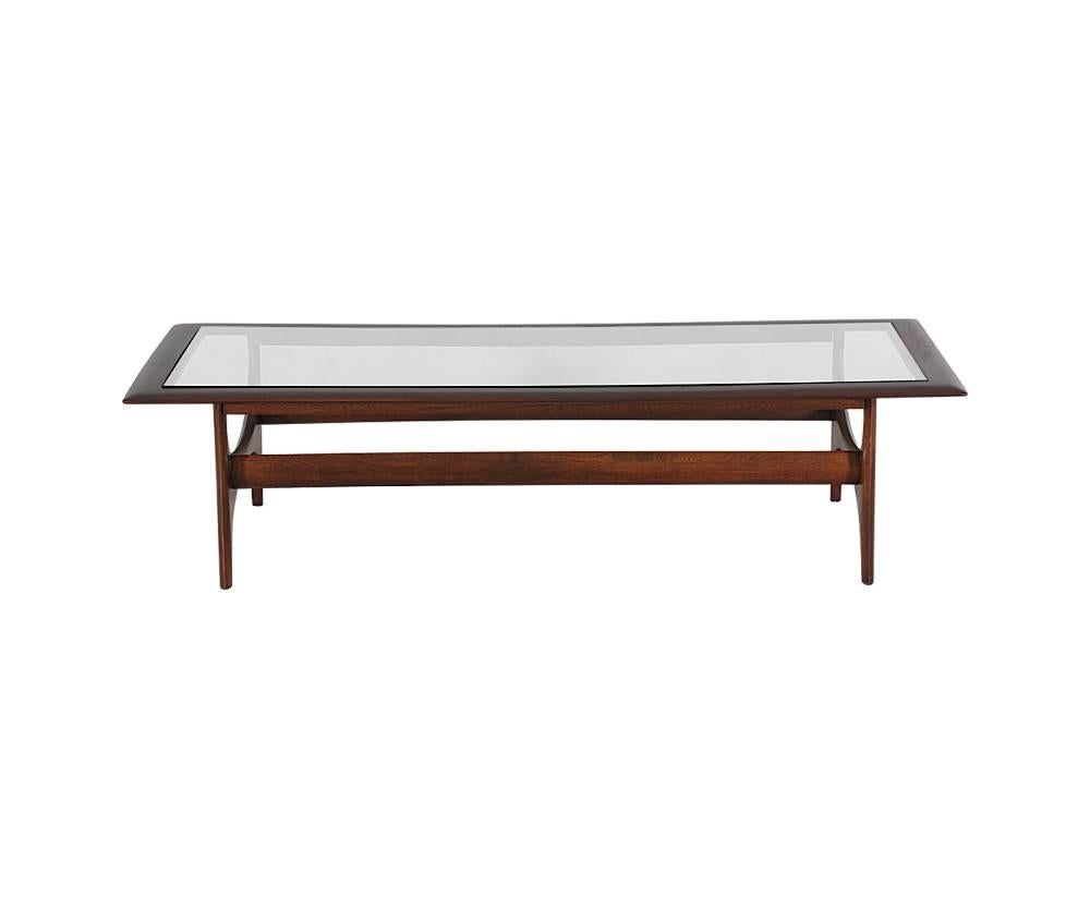 Designer: Lane Co.
Manufacturer: Lane Co.
Period/style: Mid-Century Modern
Country: United States
Date: 1960s

Dimensions: 15 H x 59 L x 24 W
Materials: Walnut wood, glass top
Condition: Excellent, newly refinished and new glass top
Number