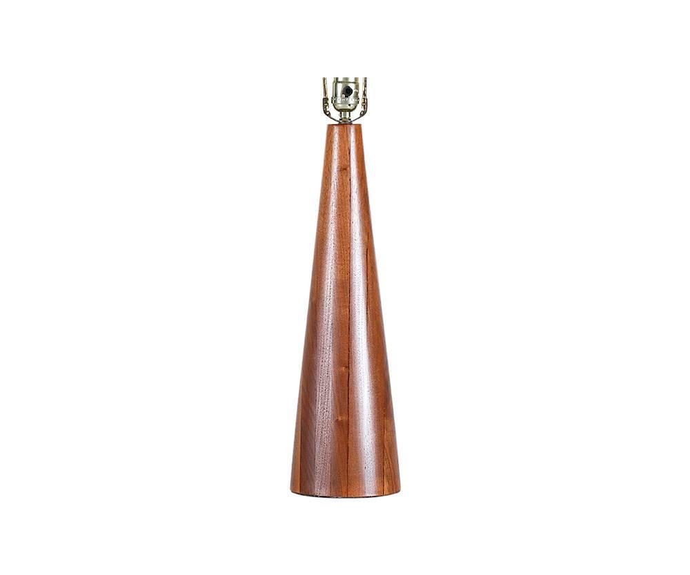 Designer: Laurel Lamp Co.
Manufacturer: Laurel Lamp Co.
Period/Style: Mid-Century Modern
Country: United States
Date: 1950s

Dimensions: 29.25 H x 5.5 W
Materials: Walnut wood, brass
Condition: Excellent, newly refinished
Number of items: