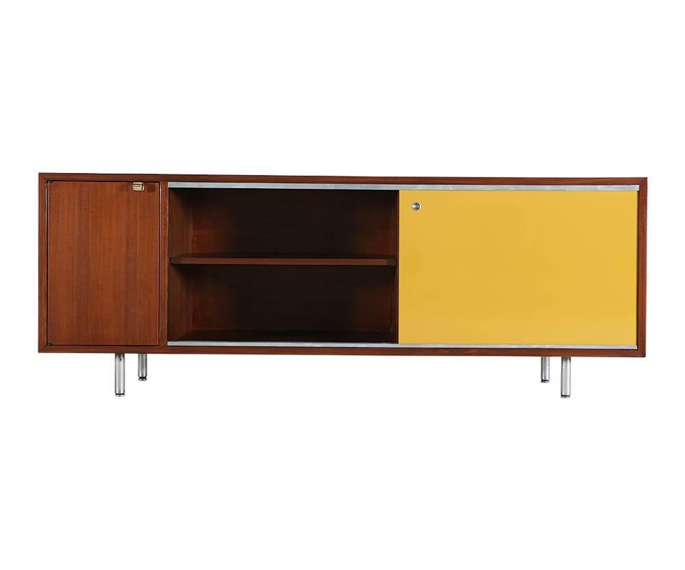 Designer: George Nelson
Manufacturer: Herman Miller
Period/Style: Mid-Century Modern
Country: United States
Date: 1950s

Dimensions: 25.25 H x 67.5 L x 18.5 W
Materials: Walnut, lacquer paint, brushed aluminum legs
Condition: Excellent,