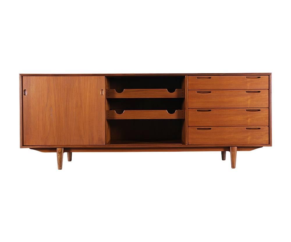 Designer: Ib Kofod-Larsen
Manufacturer: Brande Møbelfabrik
Period/Style: Danish Modern
Country: Denmark
Date: 1950s

Dimensions: 30.25?H x 78.75?L x 18.75?W
Materials: Teak
Condition: Excellent, newly refinished
Number of items: One
ID