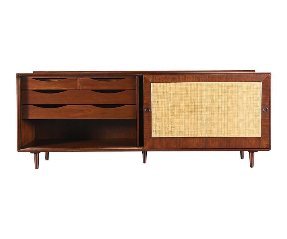 Designer: Finn Juhl
Manufacturer: Baker
Period or style: Mid-Century Modern
Country: United States
Date: 1952

Dimensions: 30?H x 78.25?L x 18?W
Materials: Walnut, new caning
Condition: Excellent, newly refinished and re-caned doors
Number