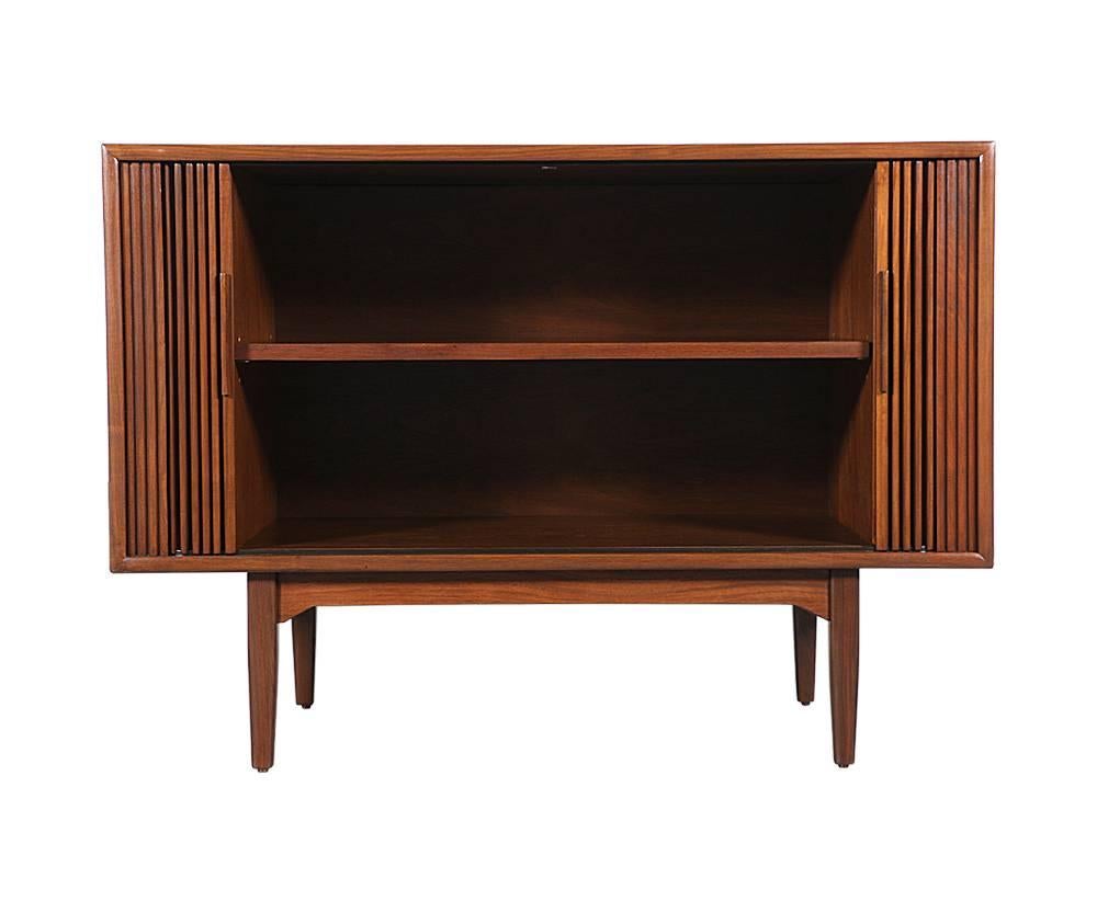 Designer: Kipp Stewart & Stewart MacDougall
Manufacturer: Drexel “Declaration”
Period/style: Mid-Century Modern
Country: United States
Date: 1950s

Dimensions: 31.25 H x 43.5 W x 19.5 D
Materials: Walnut wood
Condition: Excellent, newly